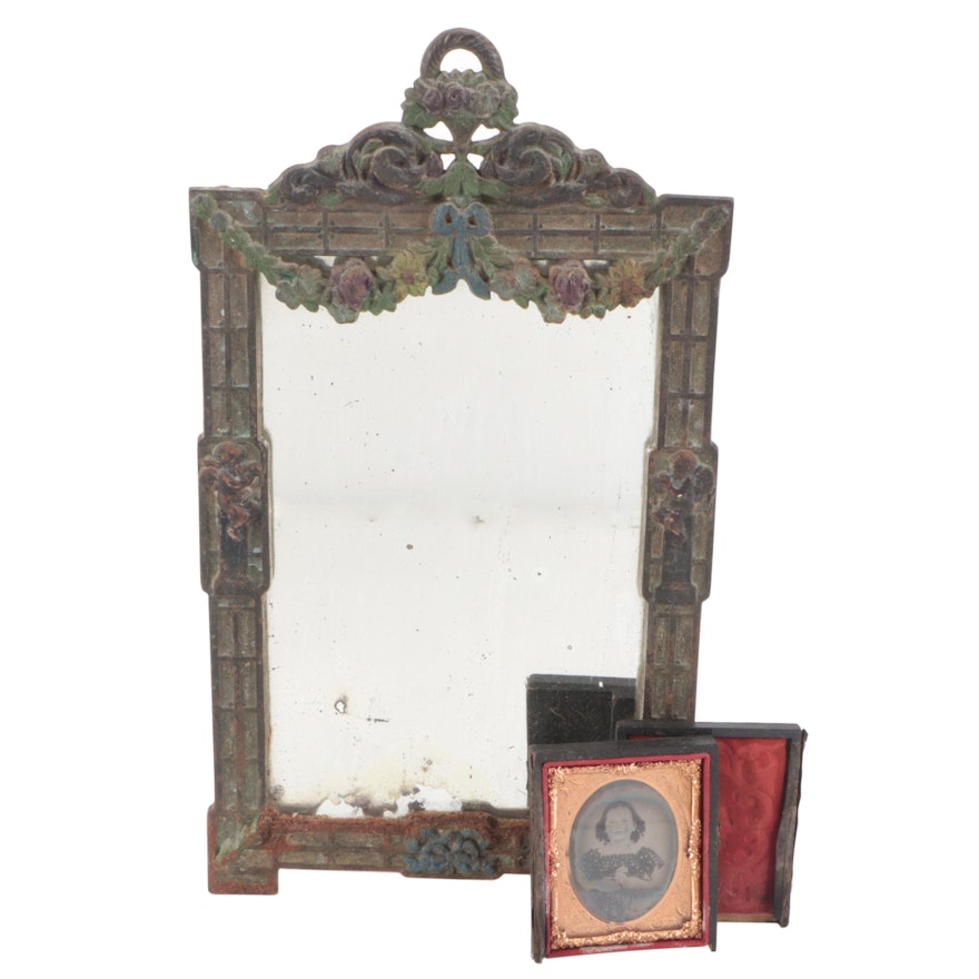 Iron Mirror with Floral Decoration and an Ambrotype Portrait of a Young Woman
