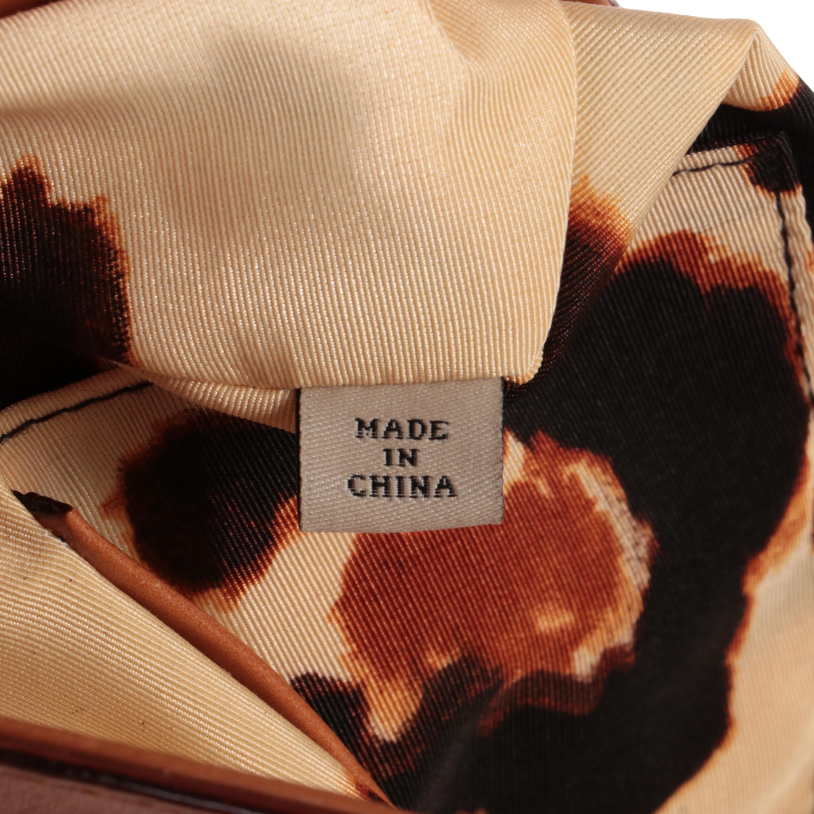 Christian Dior Tank Top, Arnold Scaasi Jumpsuit and Kate Spade Shoulder Bag