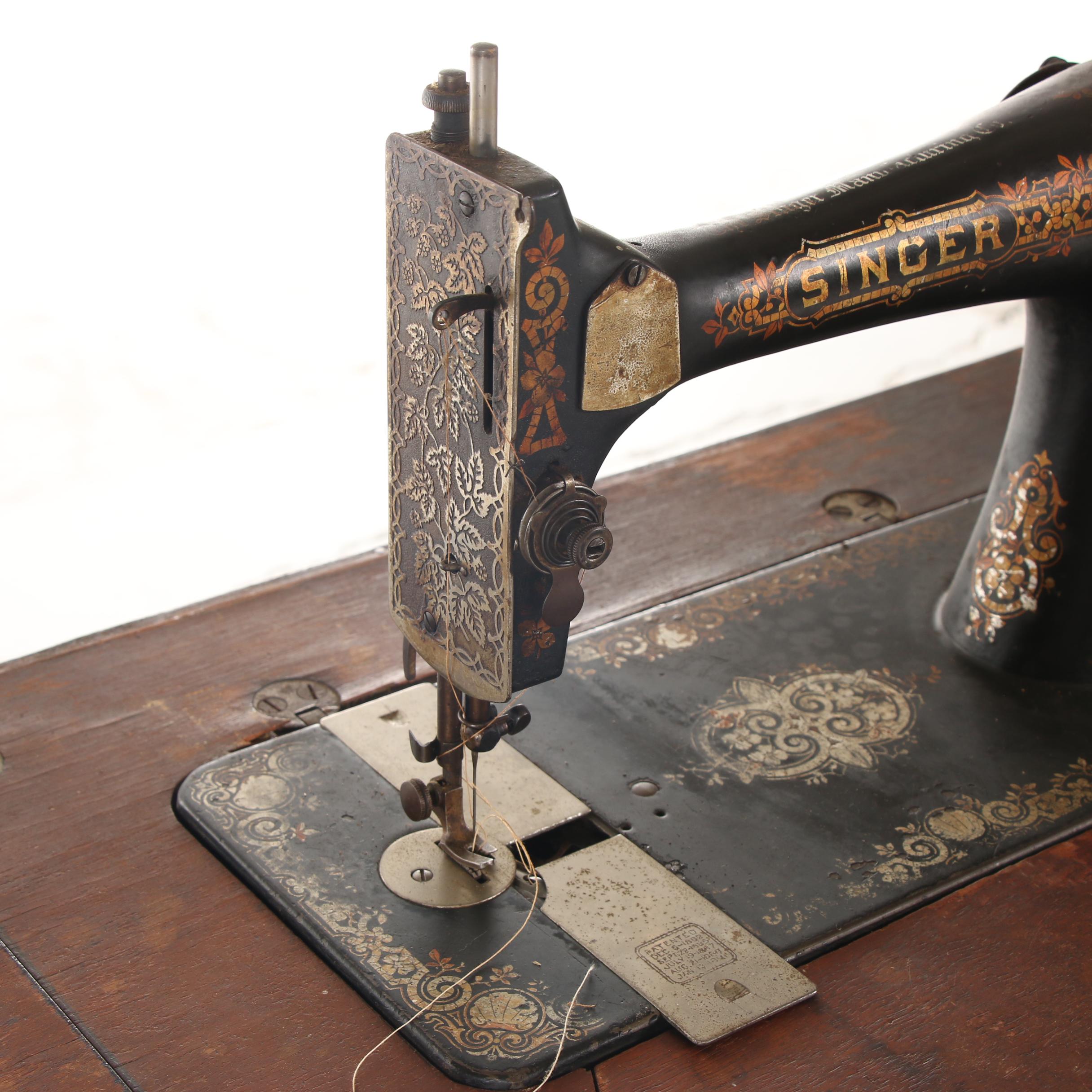Singer Treadle Sewing Machine on Oak Cabinet, Early 20th Century