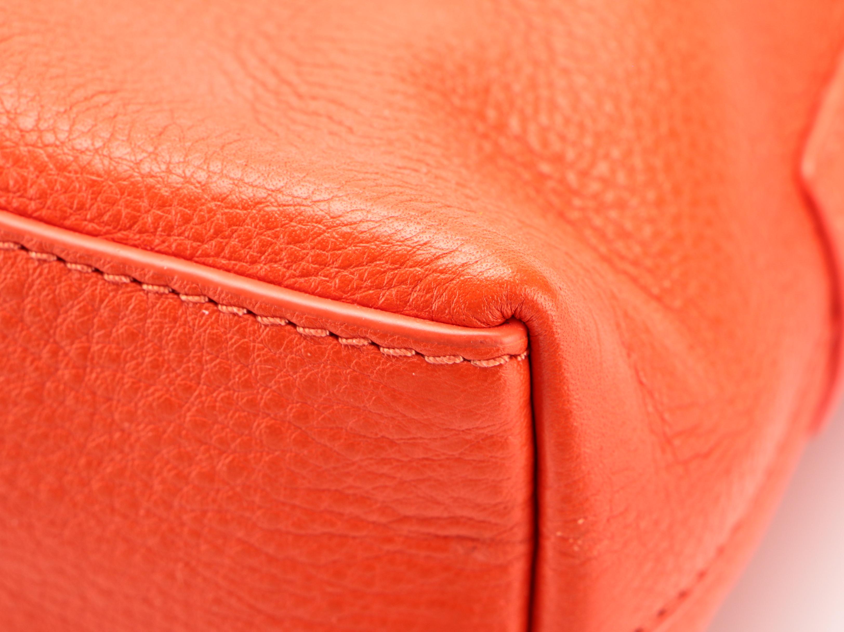 Tory Burch Crossbody Bag in Orange Leather with Braided Strap and Tassel