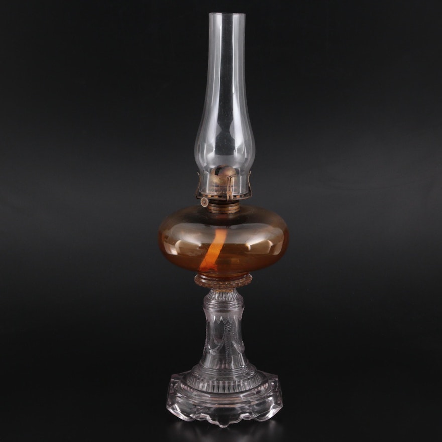 White Flame Light Co Amber and Pressed Glass Oil Lamp, Early to Mid 20th Century