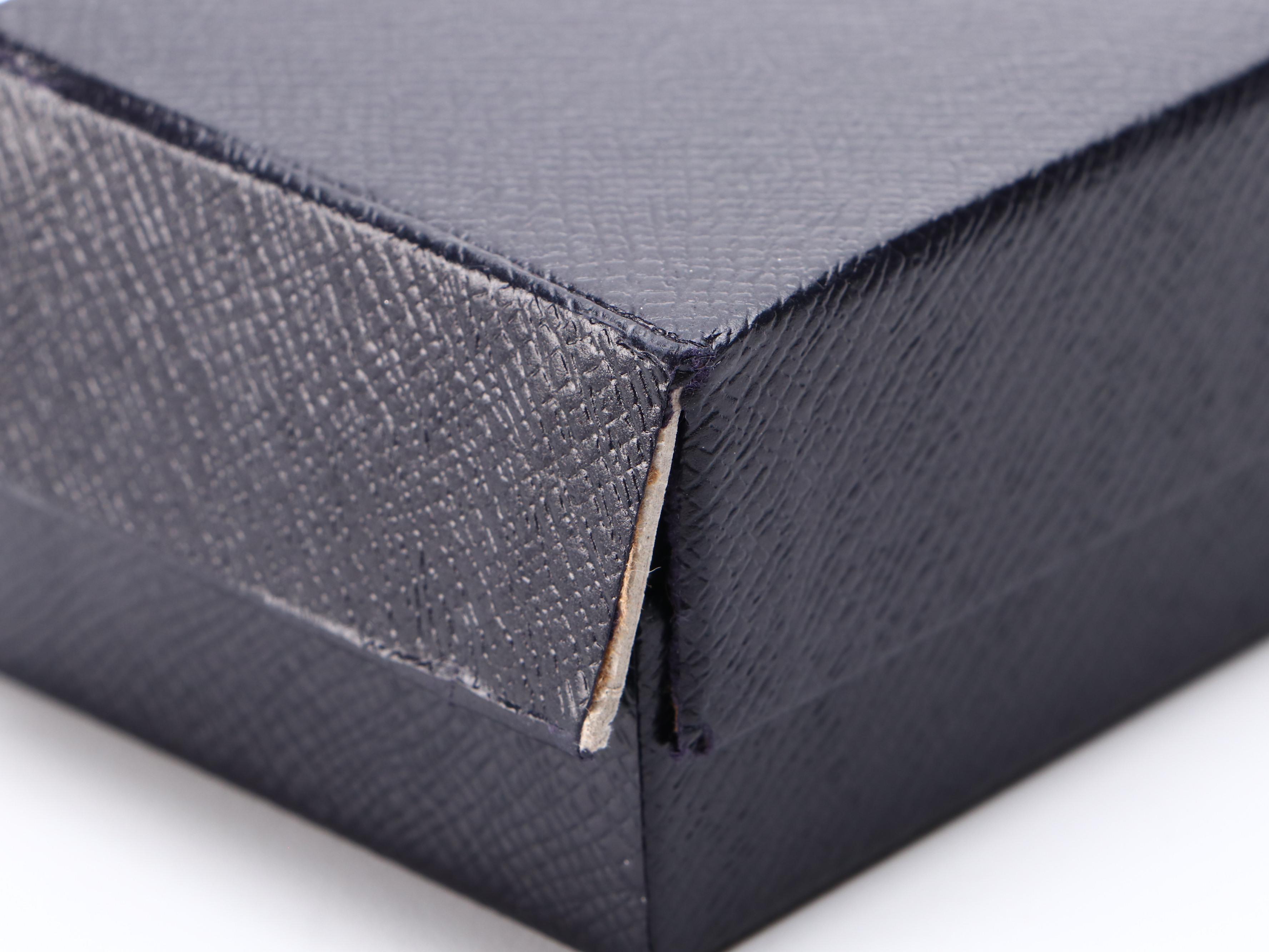 Prada SPR62T Matte Black Metal and Silver Frame Sunglasses with Polarized Lenses