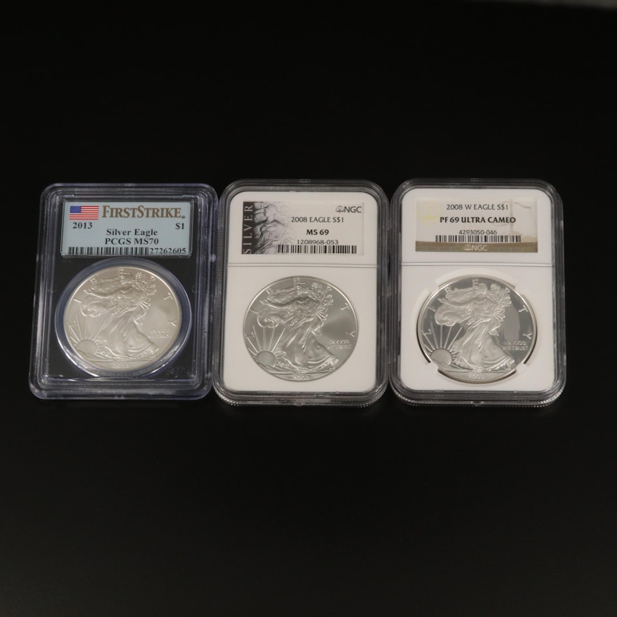 Three Graded $1 American Silver Eagle Bullion Coins