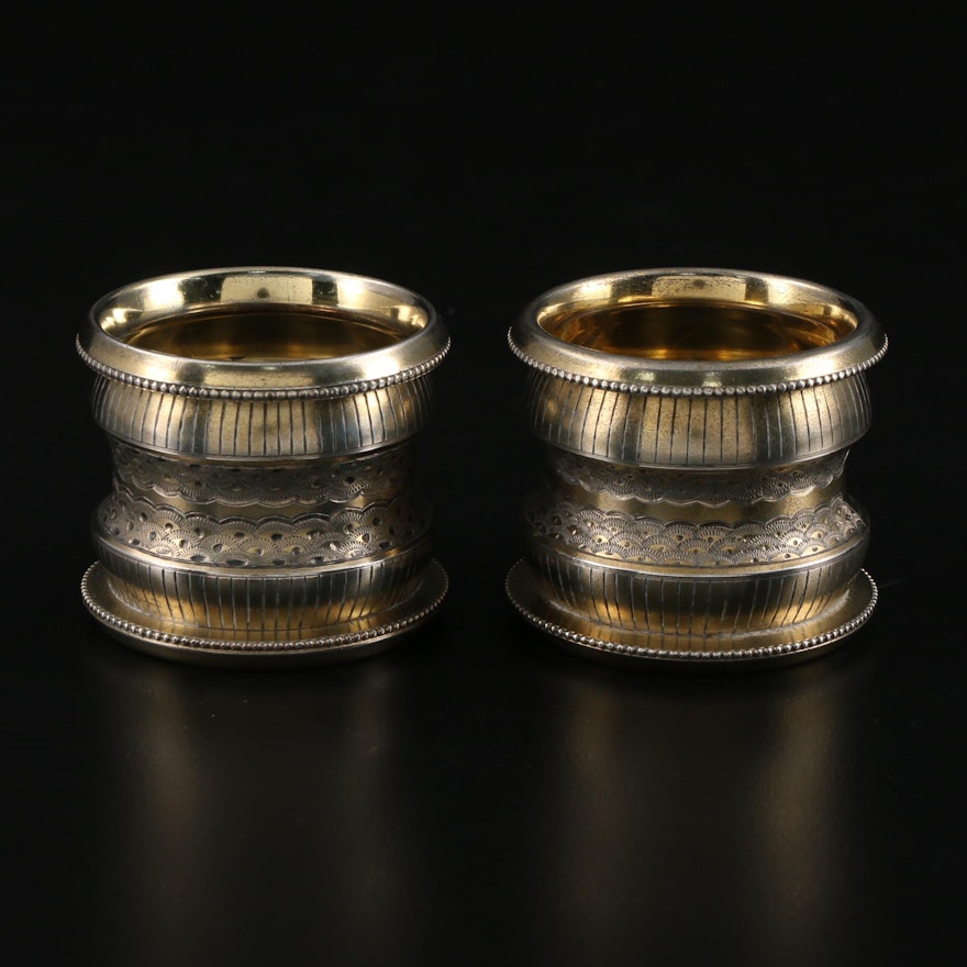 Pair of Chased and Engraved Gold Washed Metal Napkin Rings