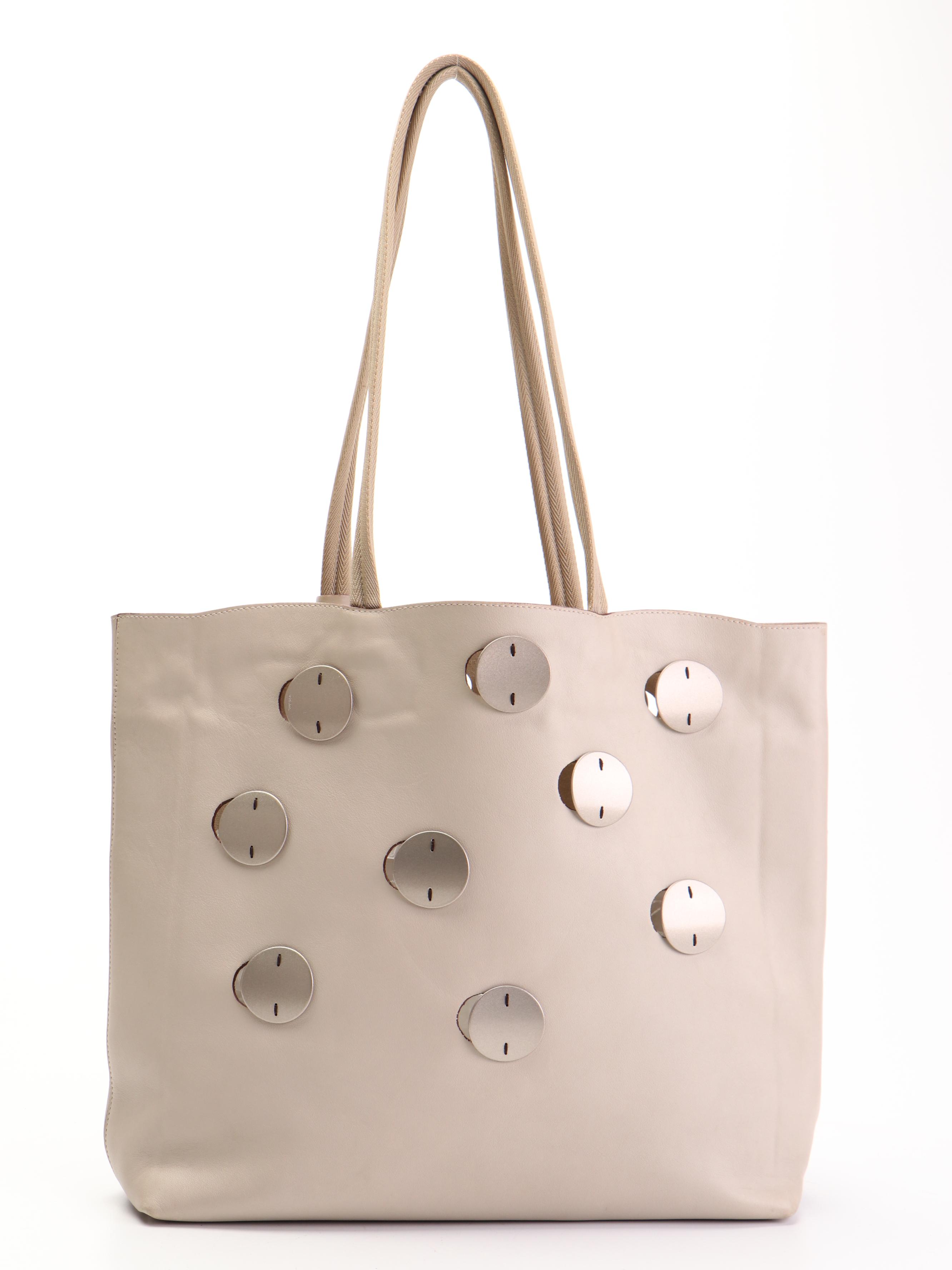 Prada Tote in Leather with Metal Circle Accents