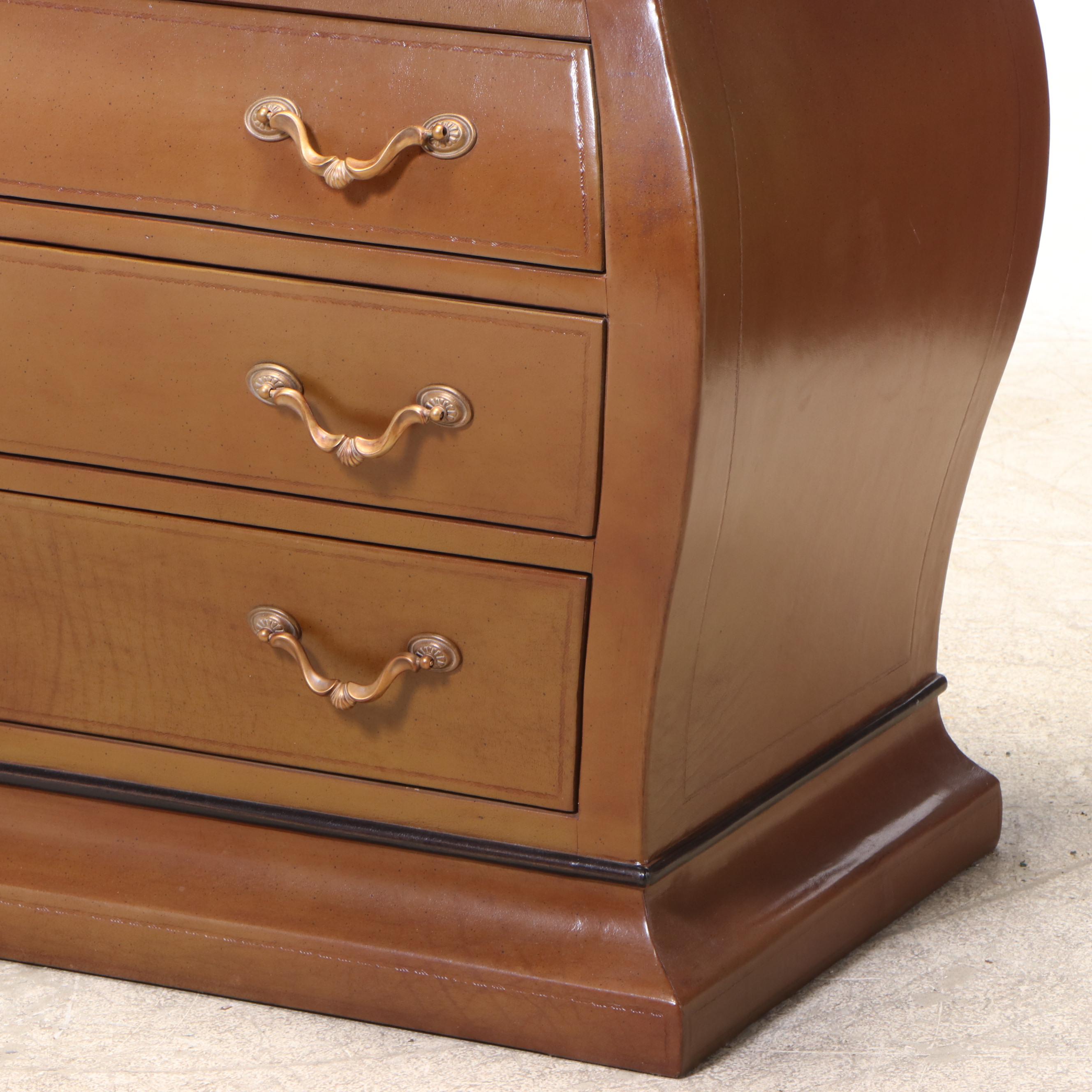 Henredon Leather-Covered and Parcel-Ebonized Bombé Chest