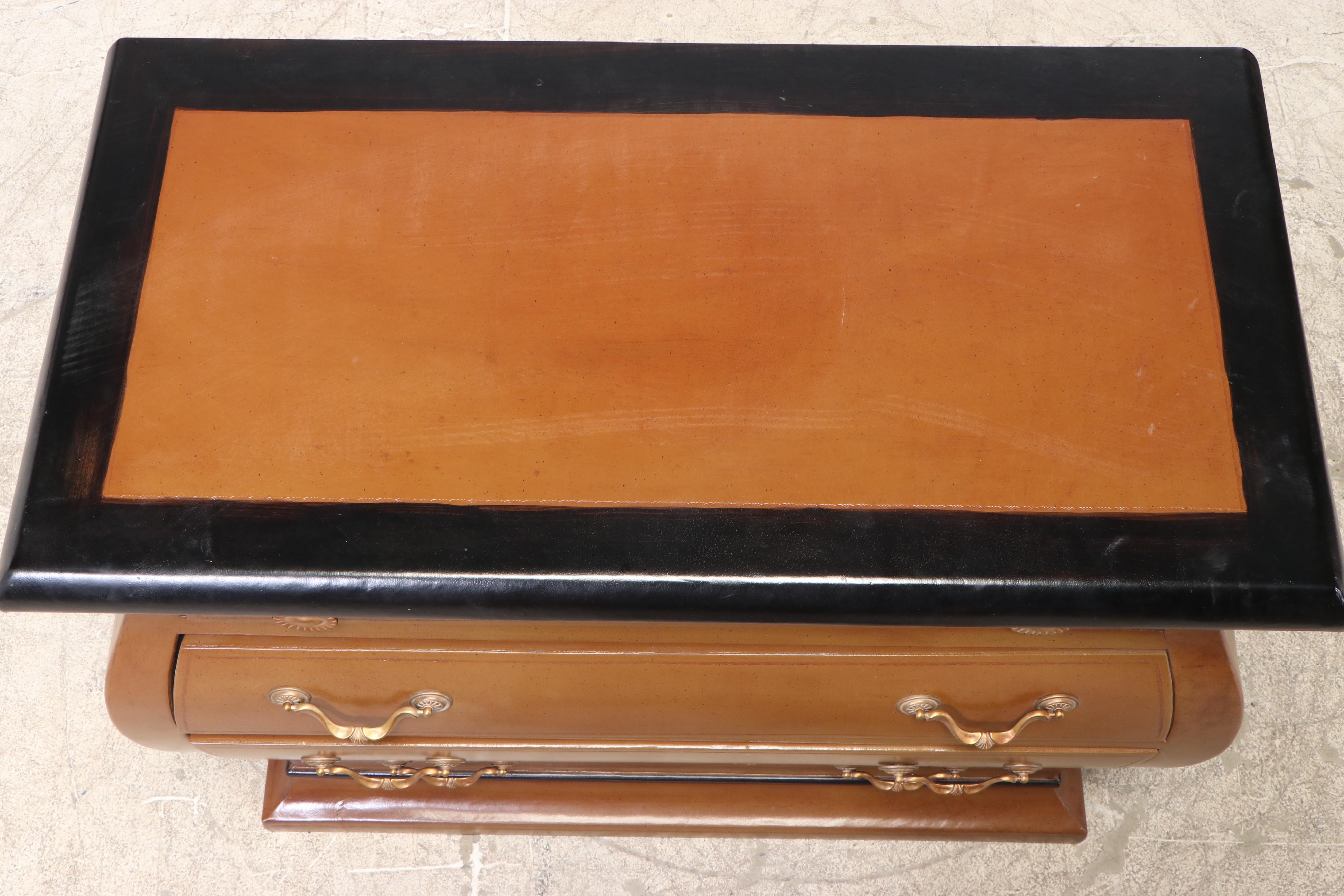 Henredon Leather-Covered and Parcel-Ebonized Bombé Chest