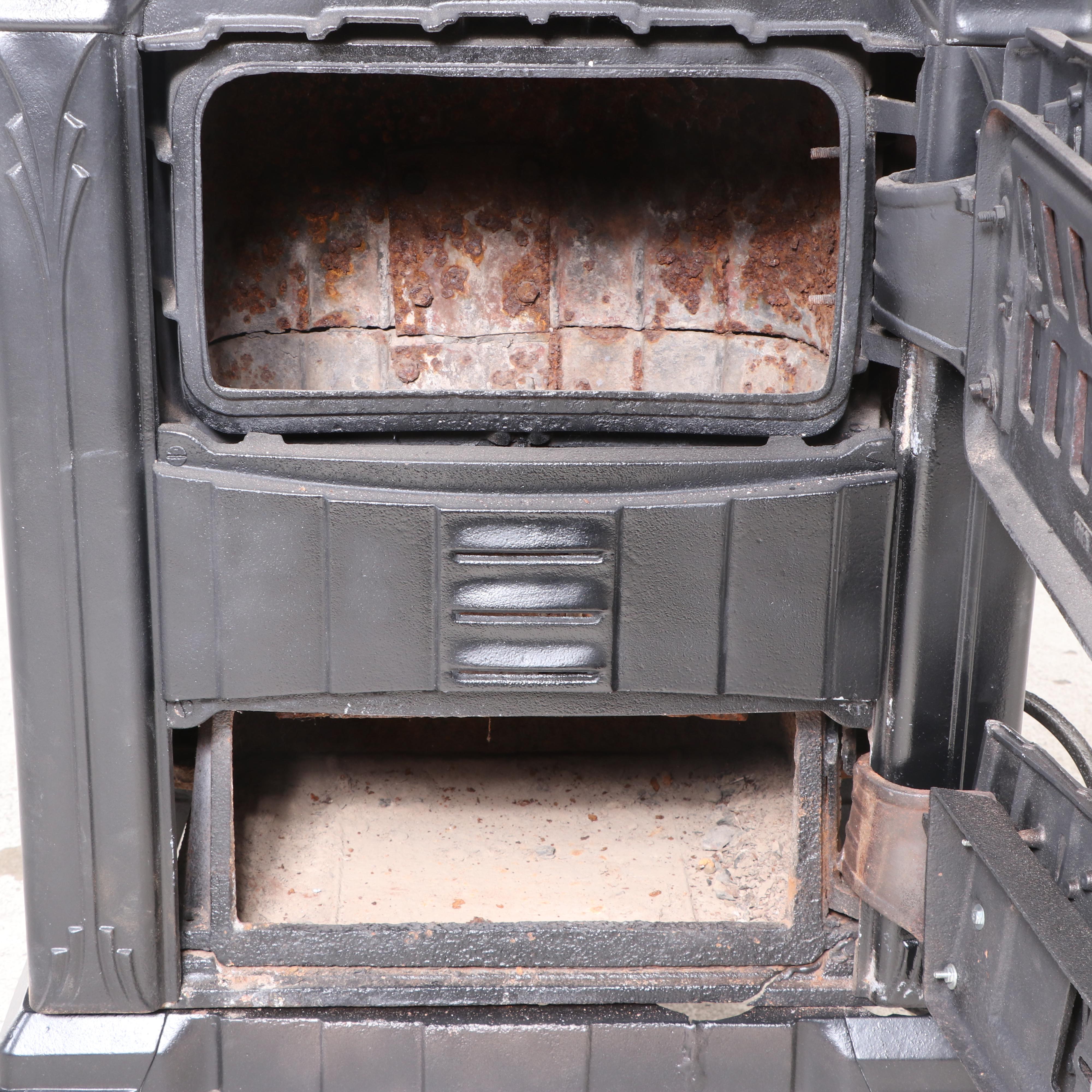 Spiegel Inc. "Fireside Sunburst" Art Deco Cast Iron Wood Stove, Early 20th C.