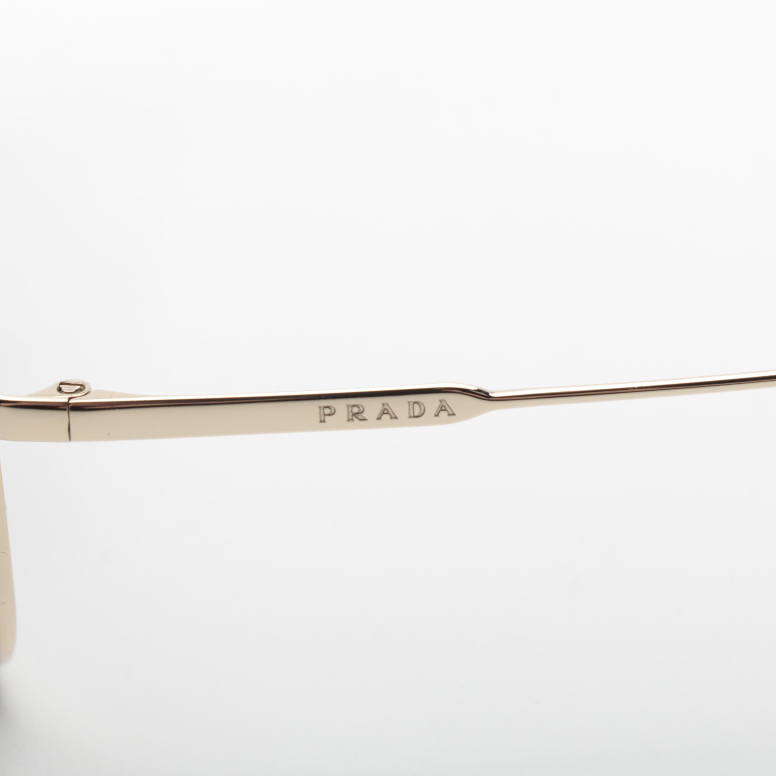 Prada SPR 50U Aviator Sunglasses in Light Gold Frame with Gradient Lenses