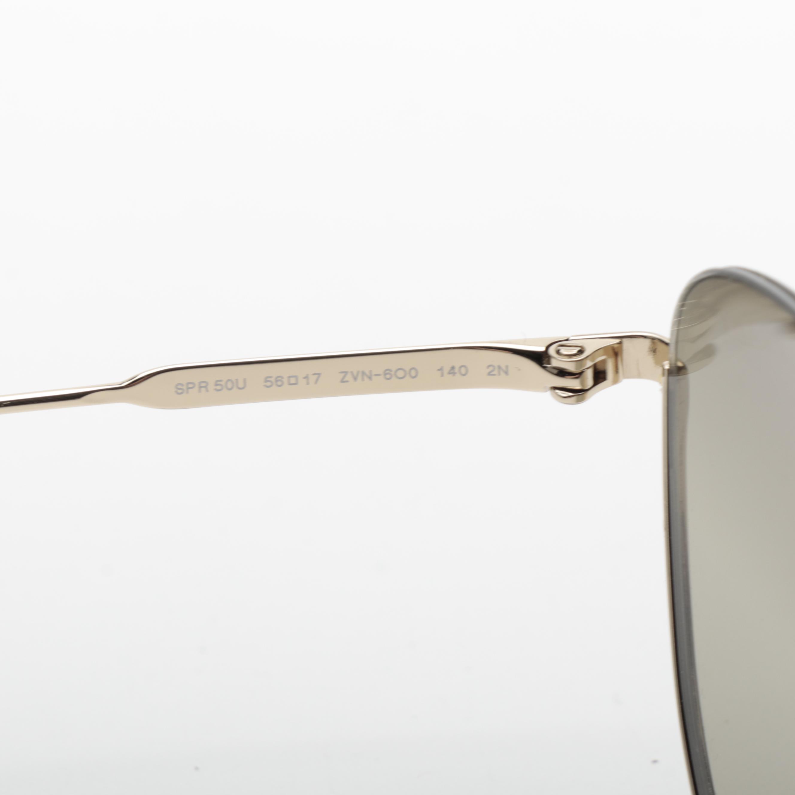 Prada SPR 50U Aviator Sunglasses in Light Gold Frame with Gradient Lenses