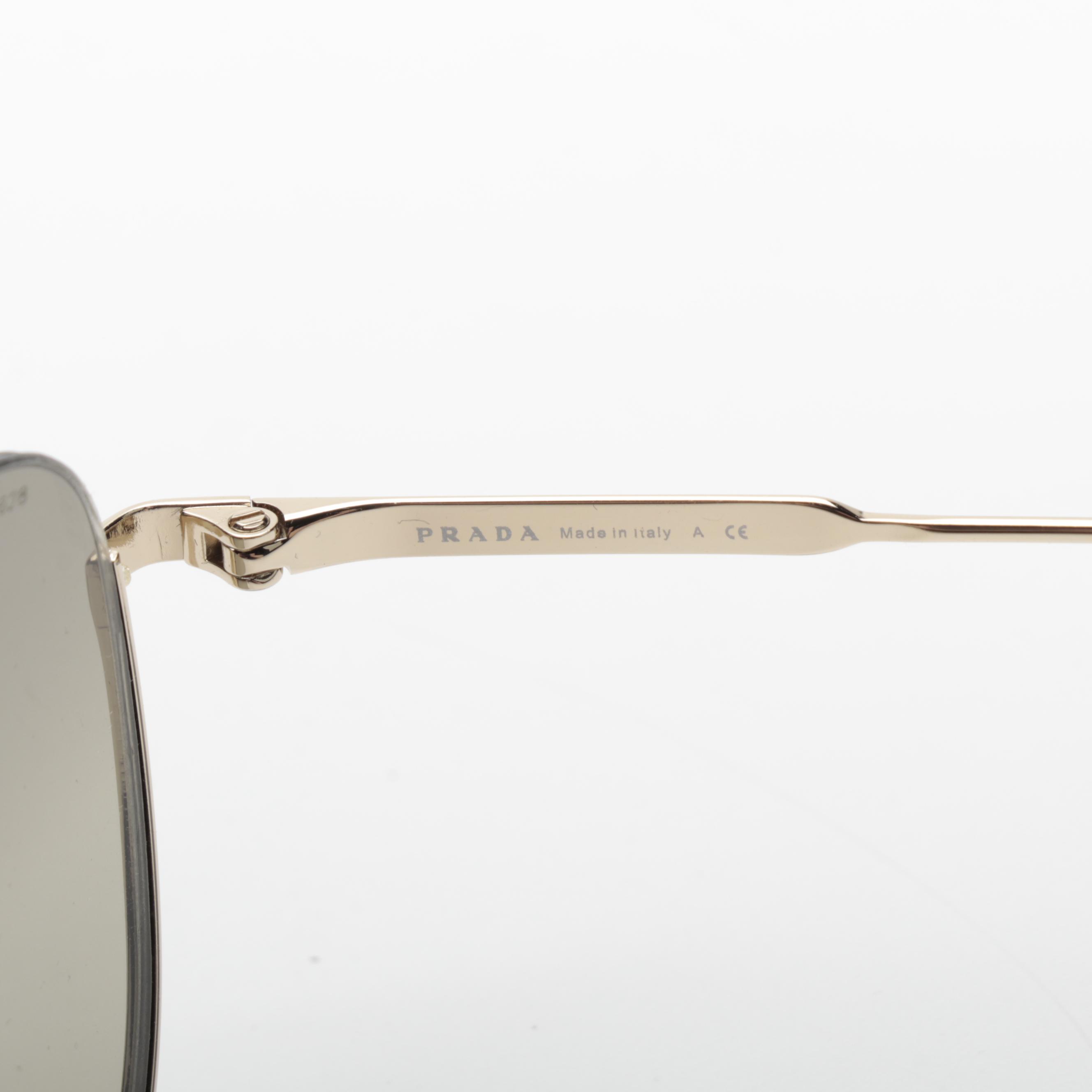 Prada SPR 50U Aviator Sunglasses in Light Gold Frame with Gradient Lenses