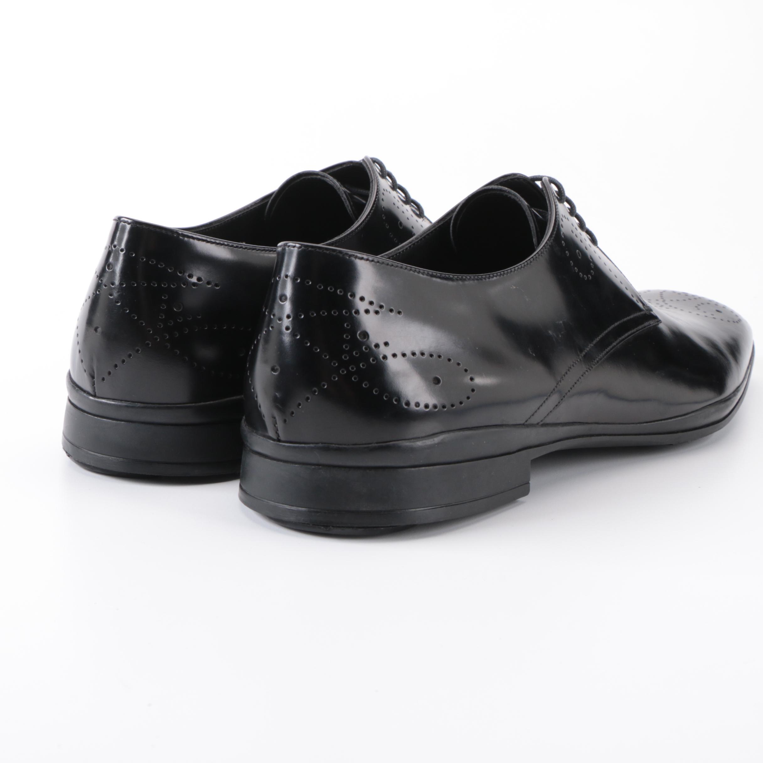 Prada Derbys in Perforated Black Spazzalato Leather with Rubber Soles