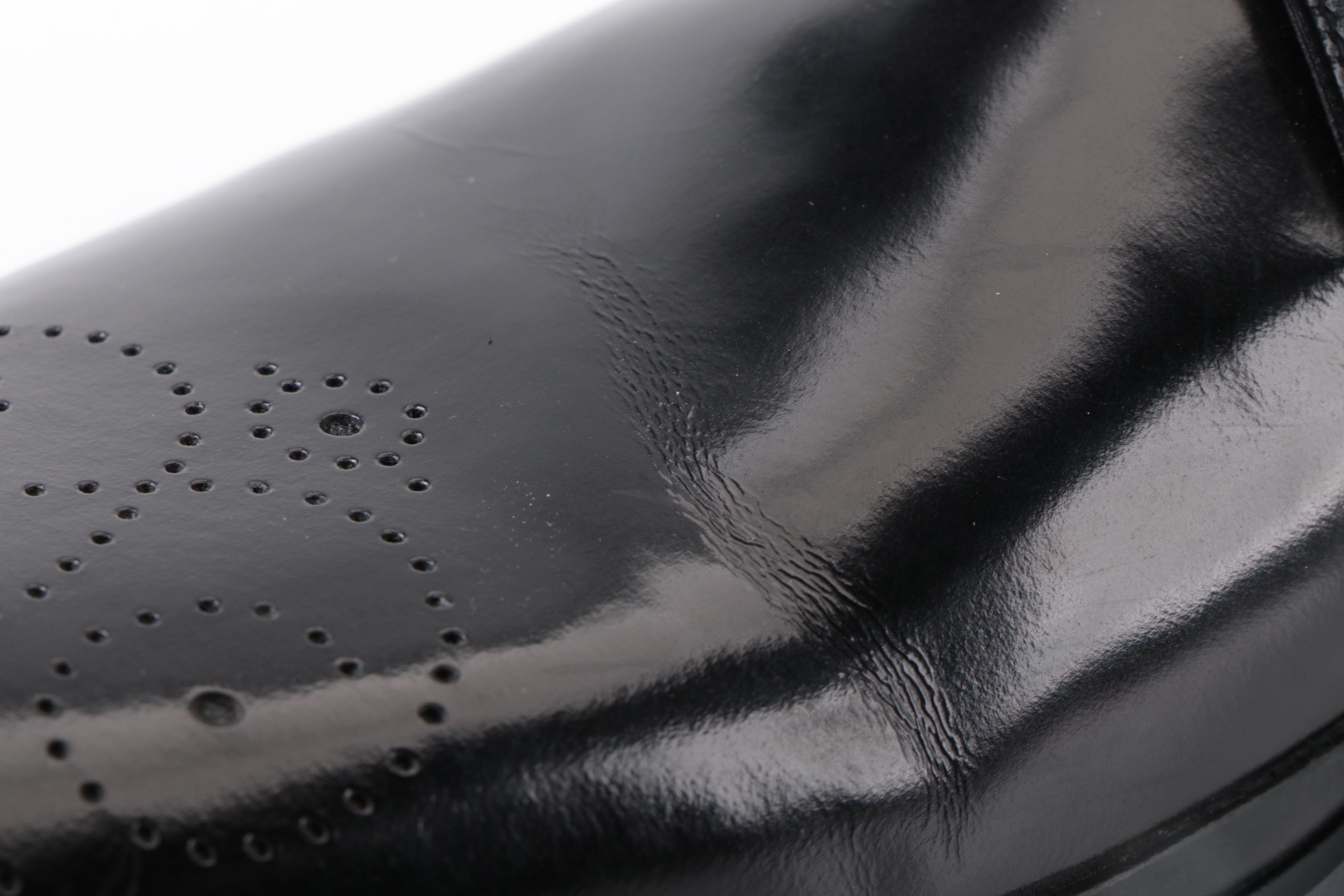 Prada Derbys in Perforated Black Spazzalato Leather with Rubber Soles