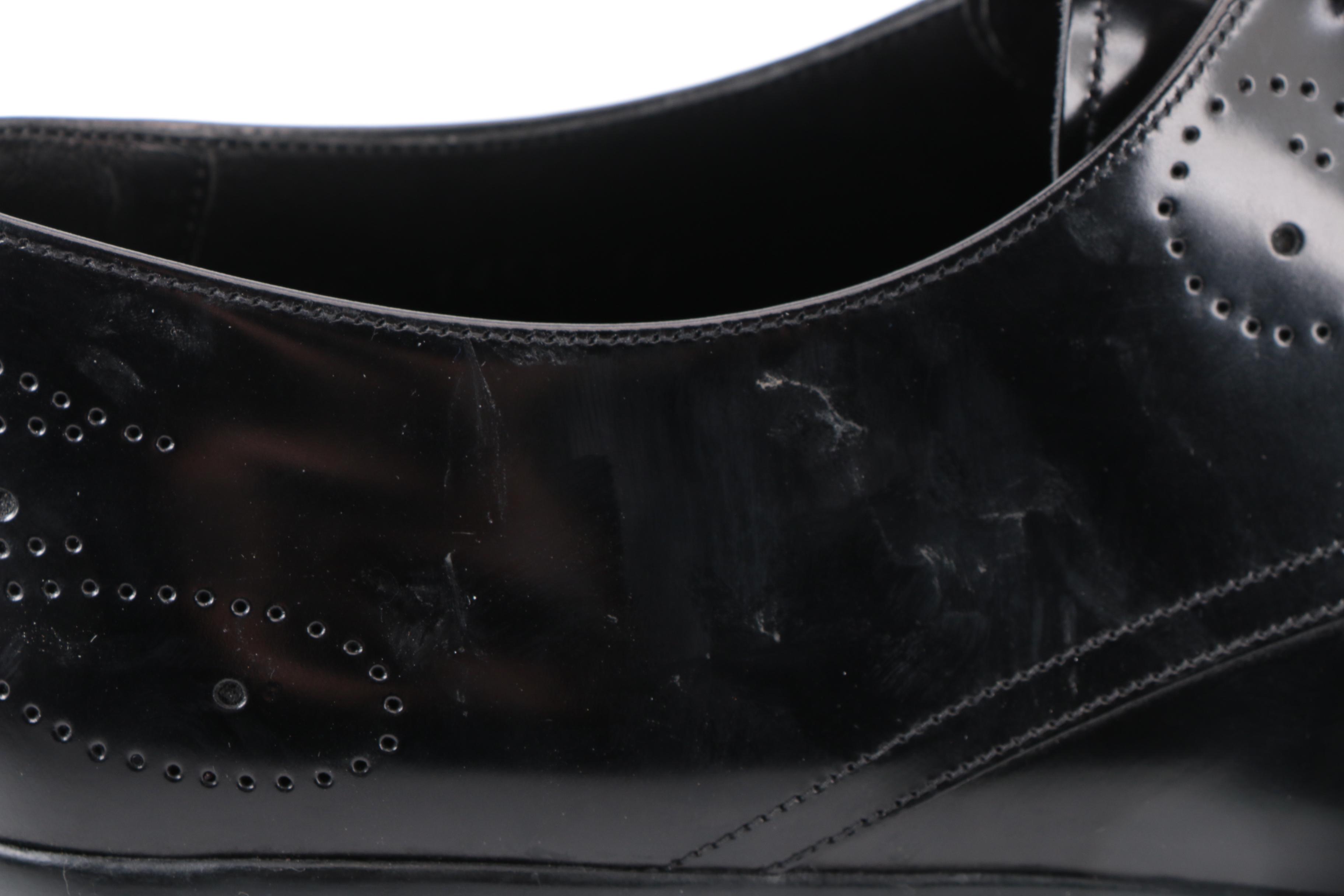 Prada Derbys in Perforated Black Spazzalato Leather with Rubber Soles
