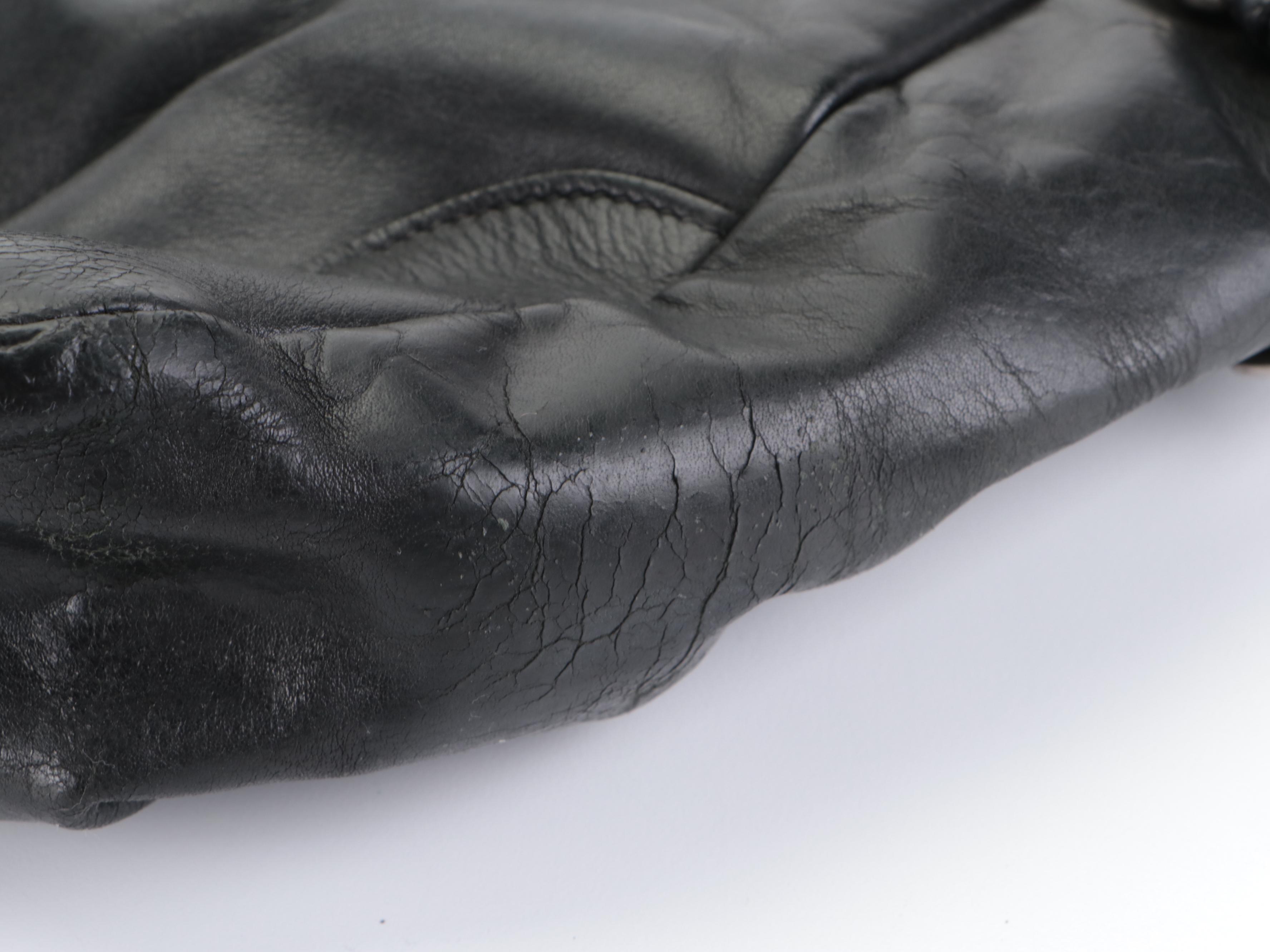 Prada Side Pocket Shoulder Bag with Buckle Strap Accents in Black Leather