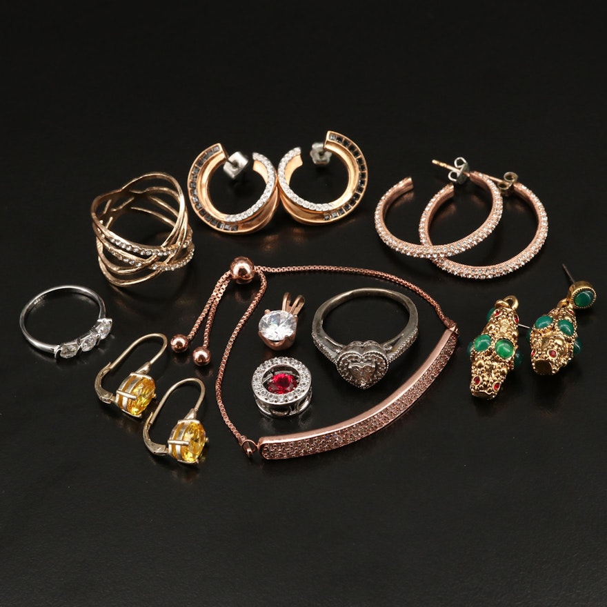 Earrings, Rings Pendants and Bolo Bracelet Featuring Sterling and Swarovski