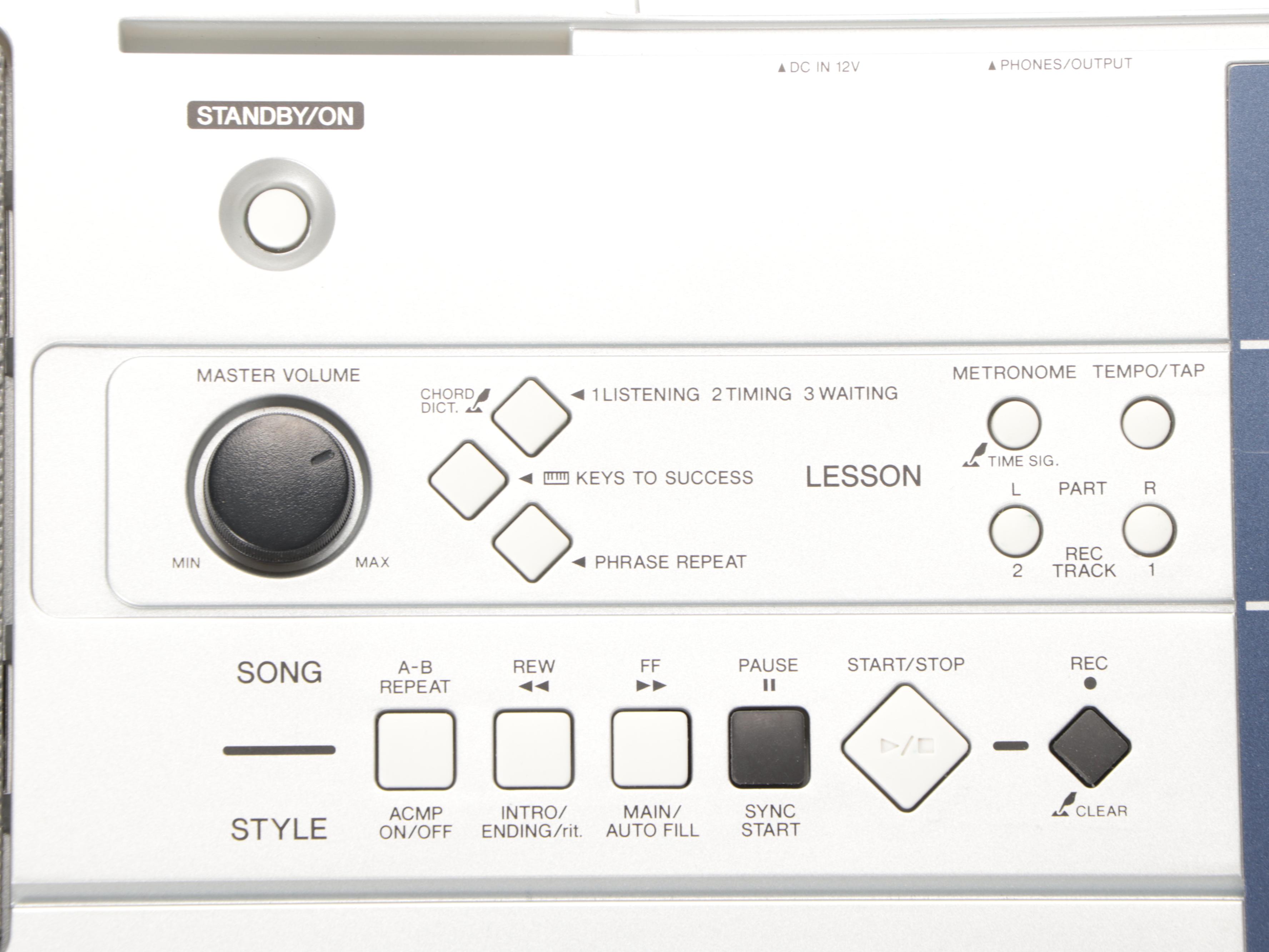 Yamaha PSR-E323 Digital Keyboard with Manual, Headphones and Foot Pedal