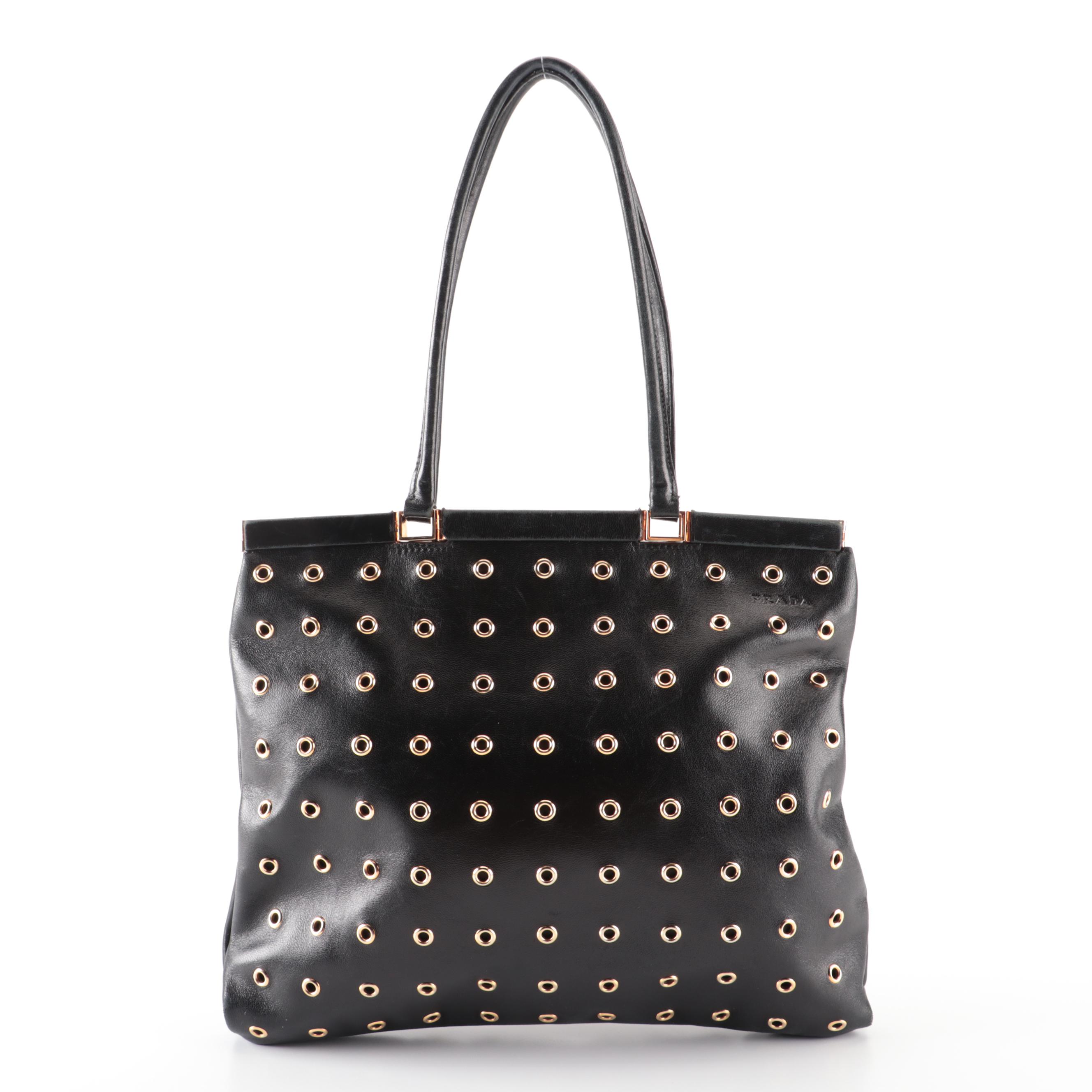 Prada Hinged Flat Shoulder Bag in Black Lambskin with Grommet Detail