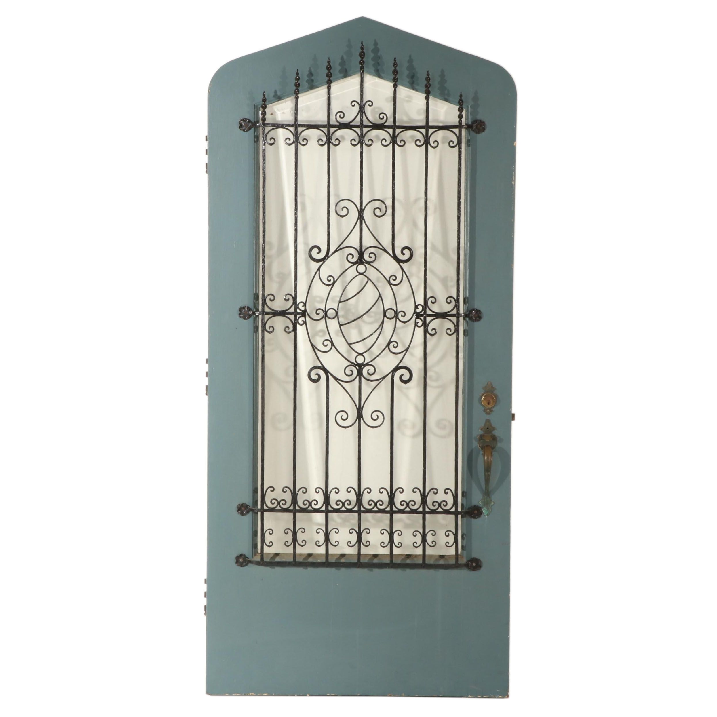 Gothic-Arched Exterior Door with Wrought Iron Grill and Beveled Glass