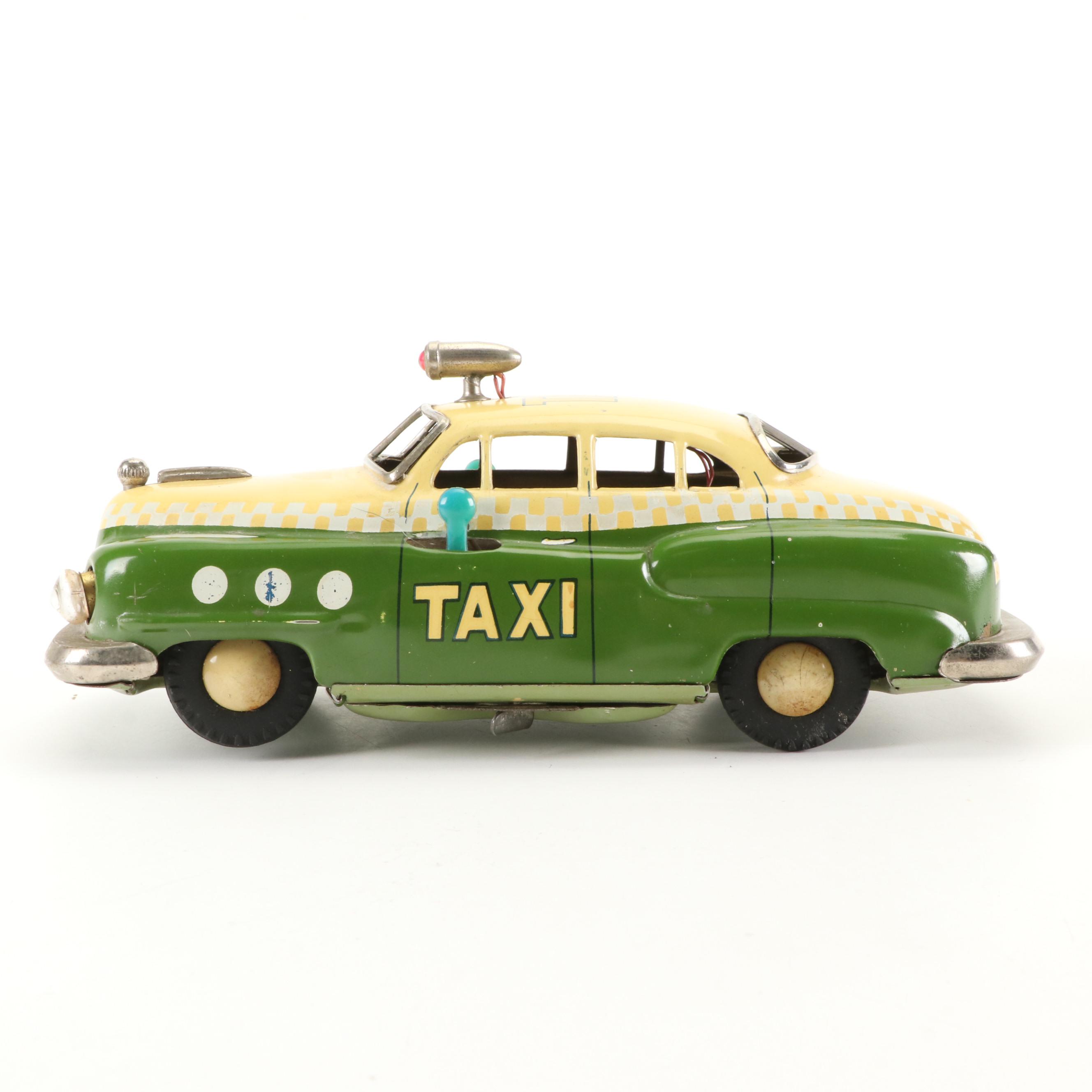 Mizuno Electromobile Tin Lithograph Battery Operated Taxi with Friction Cabs