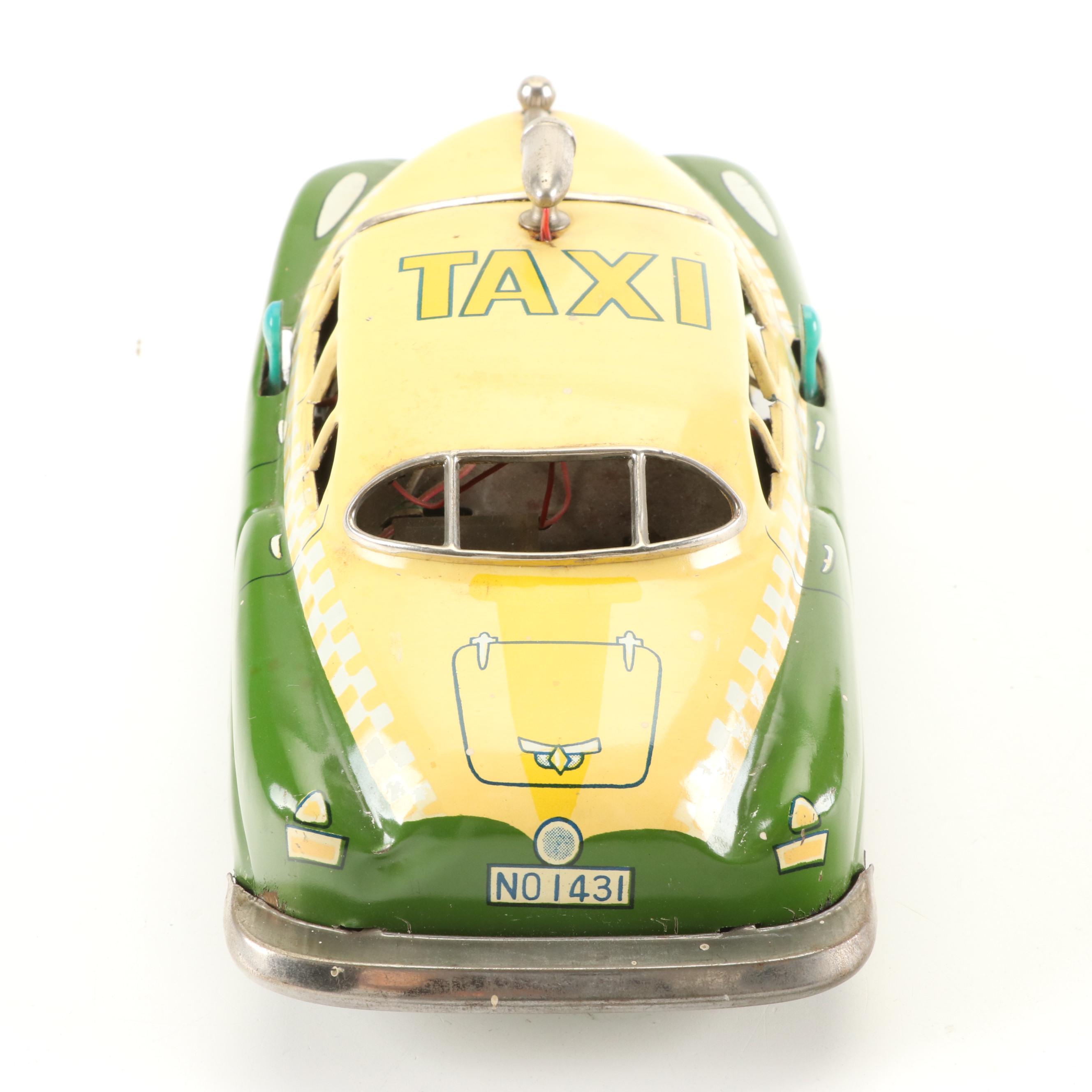 Mizuno Electromobile Tin Lithograph Battery Operated Taxi with Friction Cabs