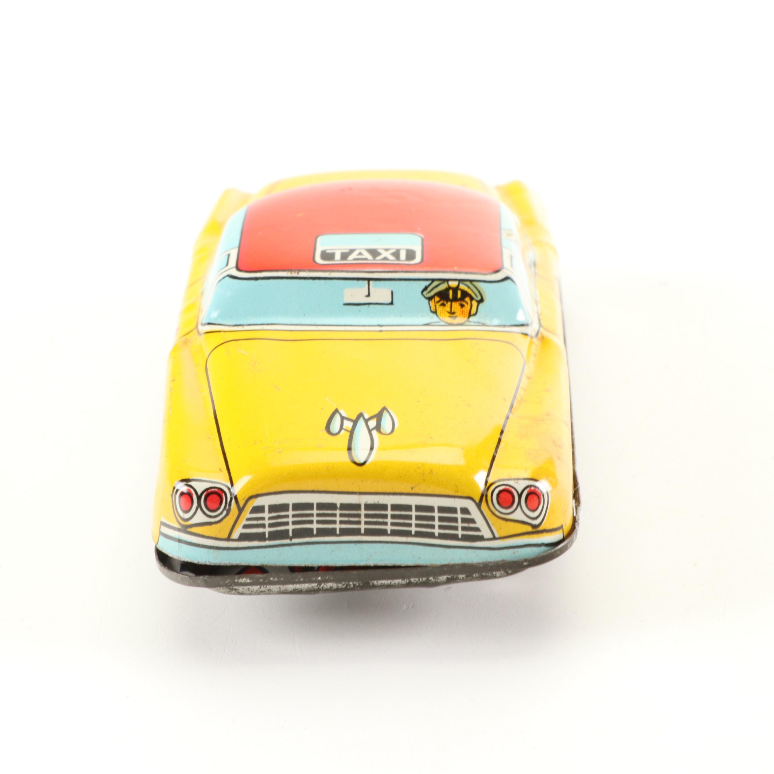 Mizuno Electromobile Tin Lithograph Battery Operated Taxi with Friction Cabs