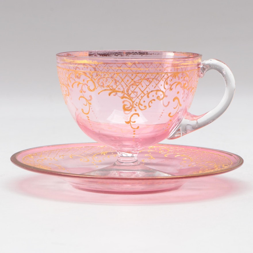 Moser Gilt and Enamel Decorated Pink Glass Teacup and Saucer