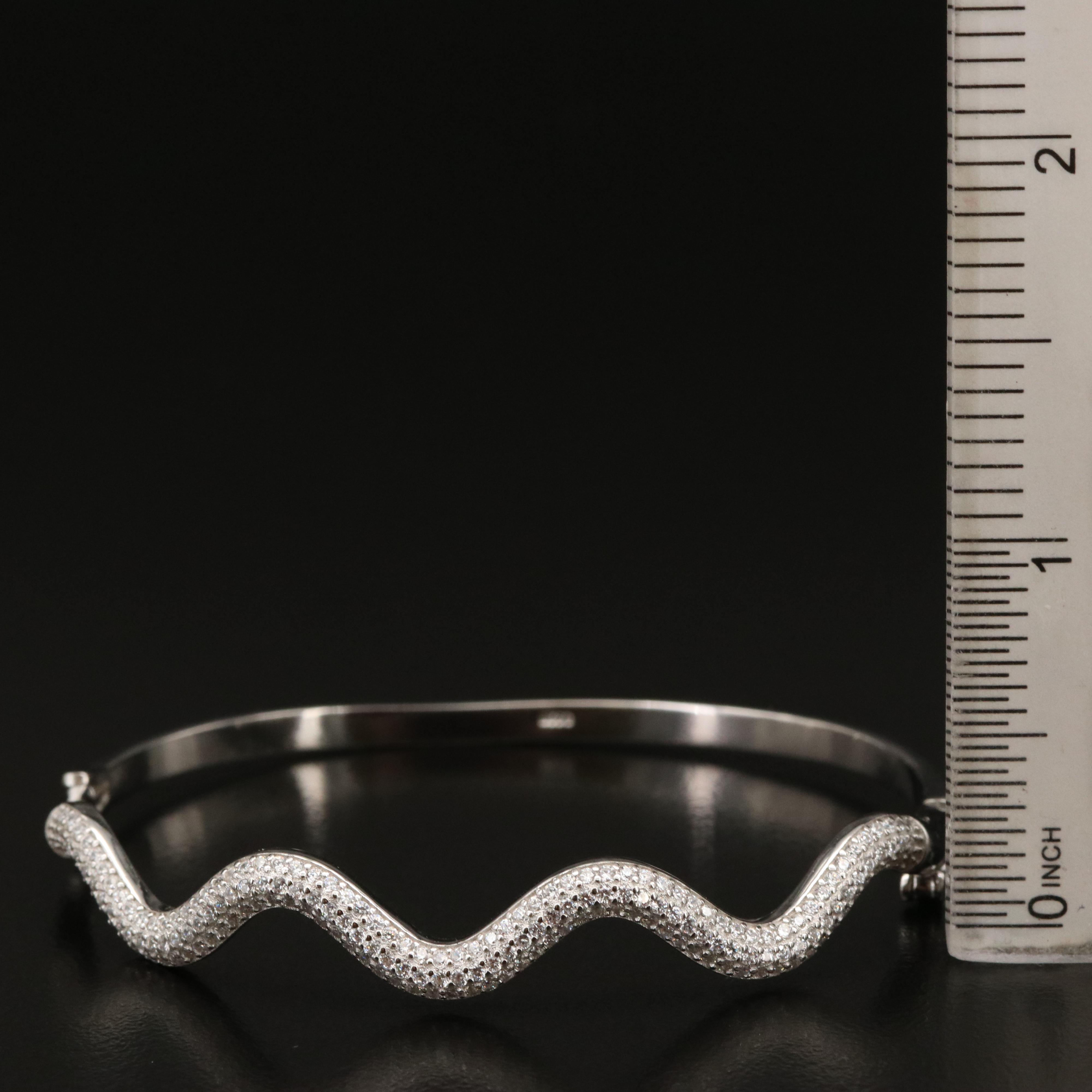 Pair of Gem Encrusted Hinged Bangles