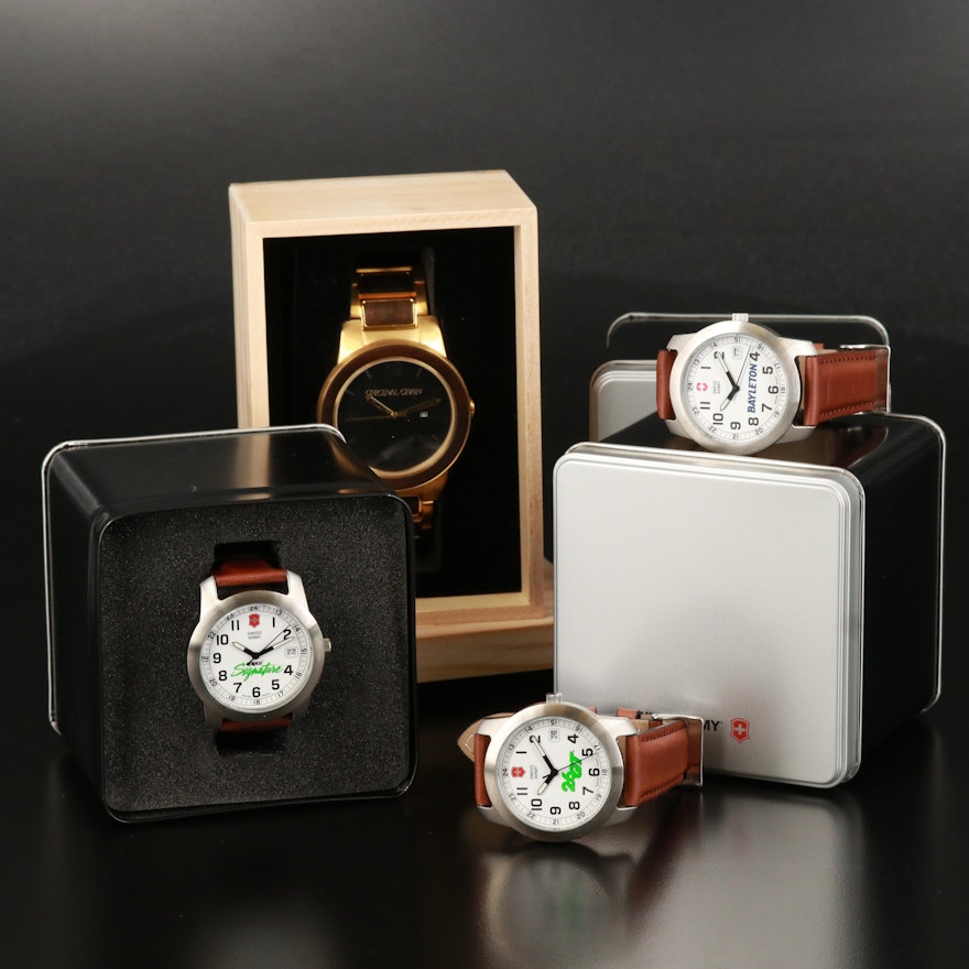 Four Quartz Wristwatches with Boxes