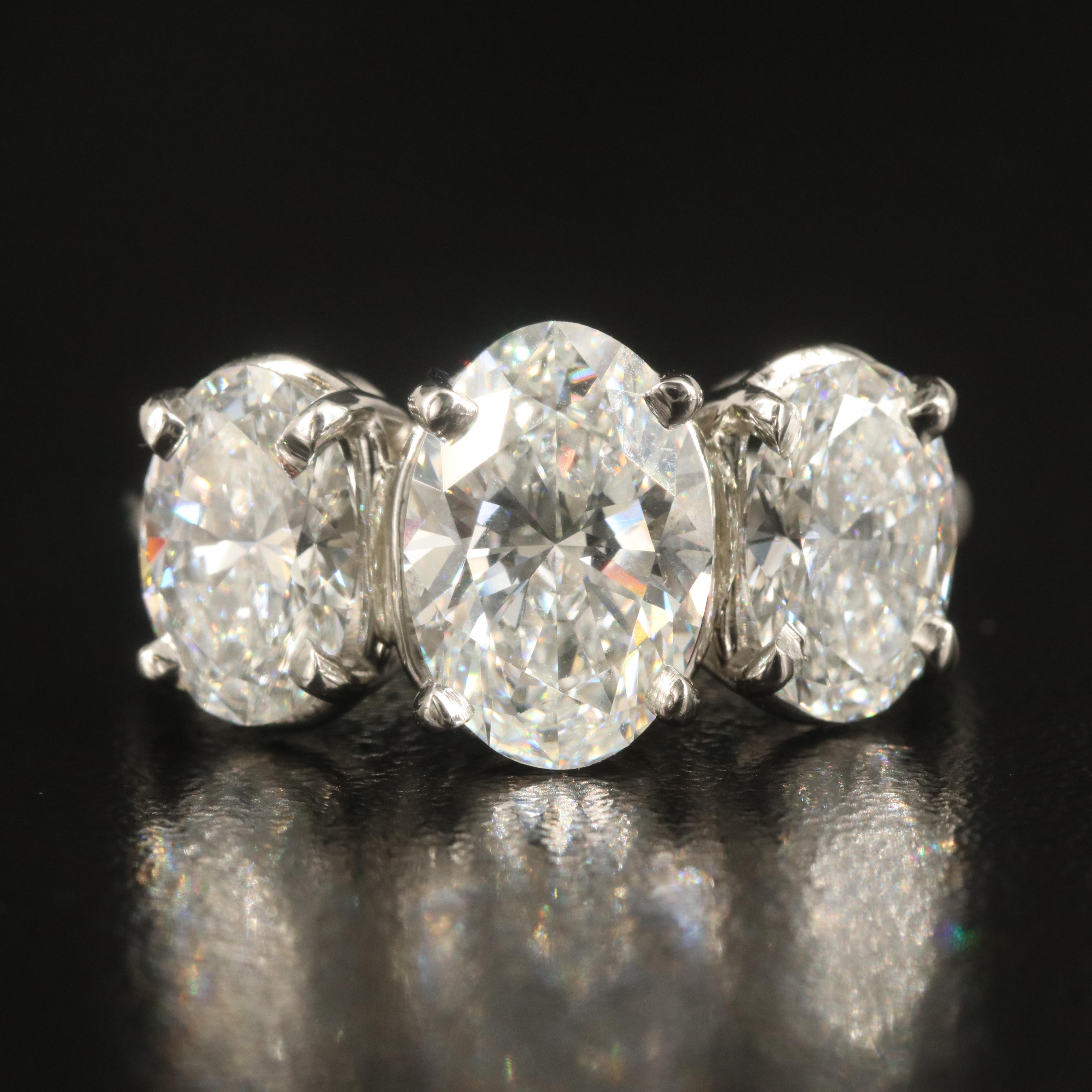 Platinum 4.28 CTW Diamond Three Stone Ring with IGI Reports