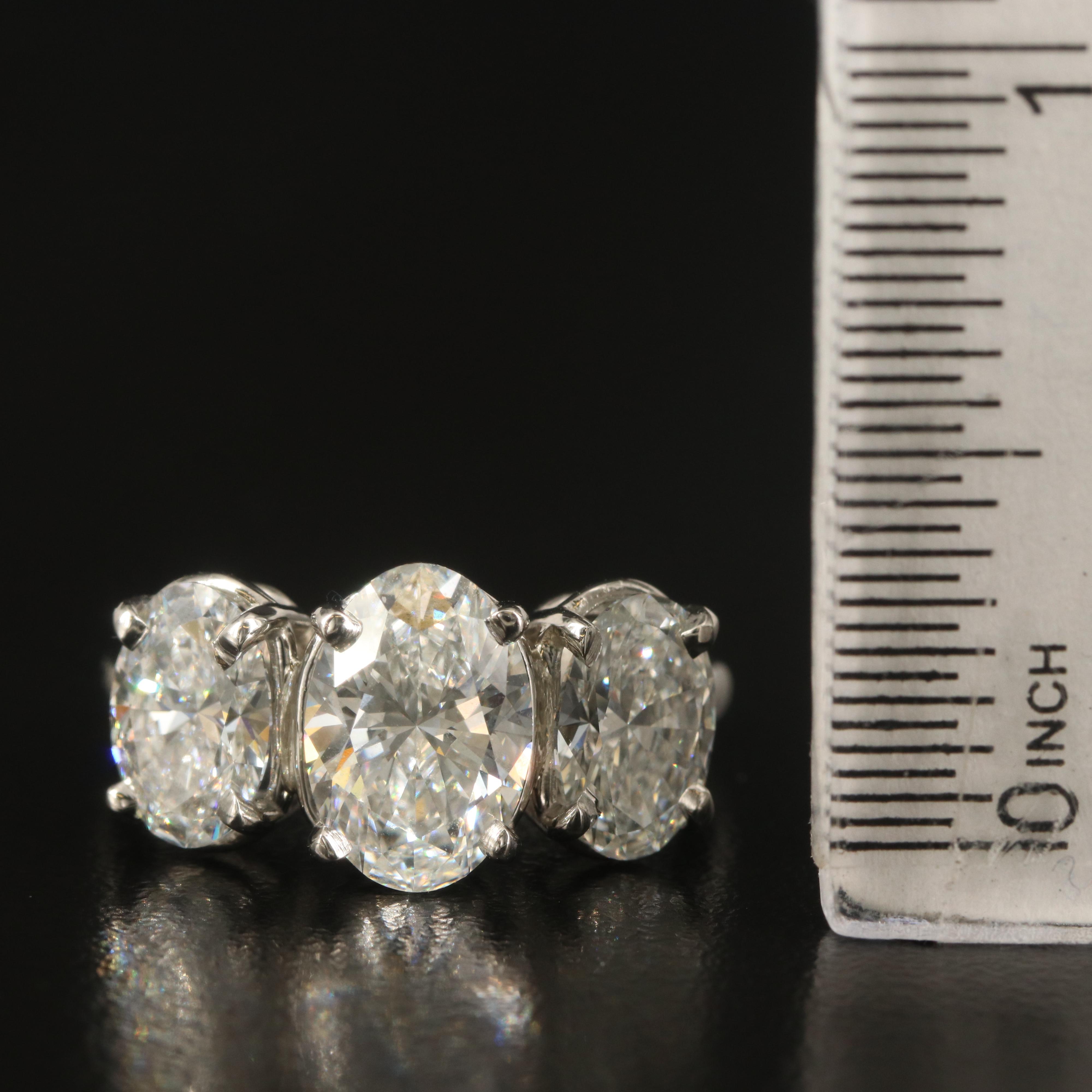 Platinum 4.28 CTW Diamond Three Stone Ring with IGI Reports