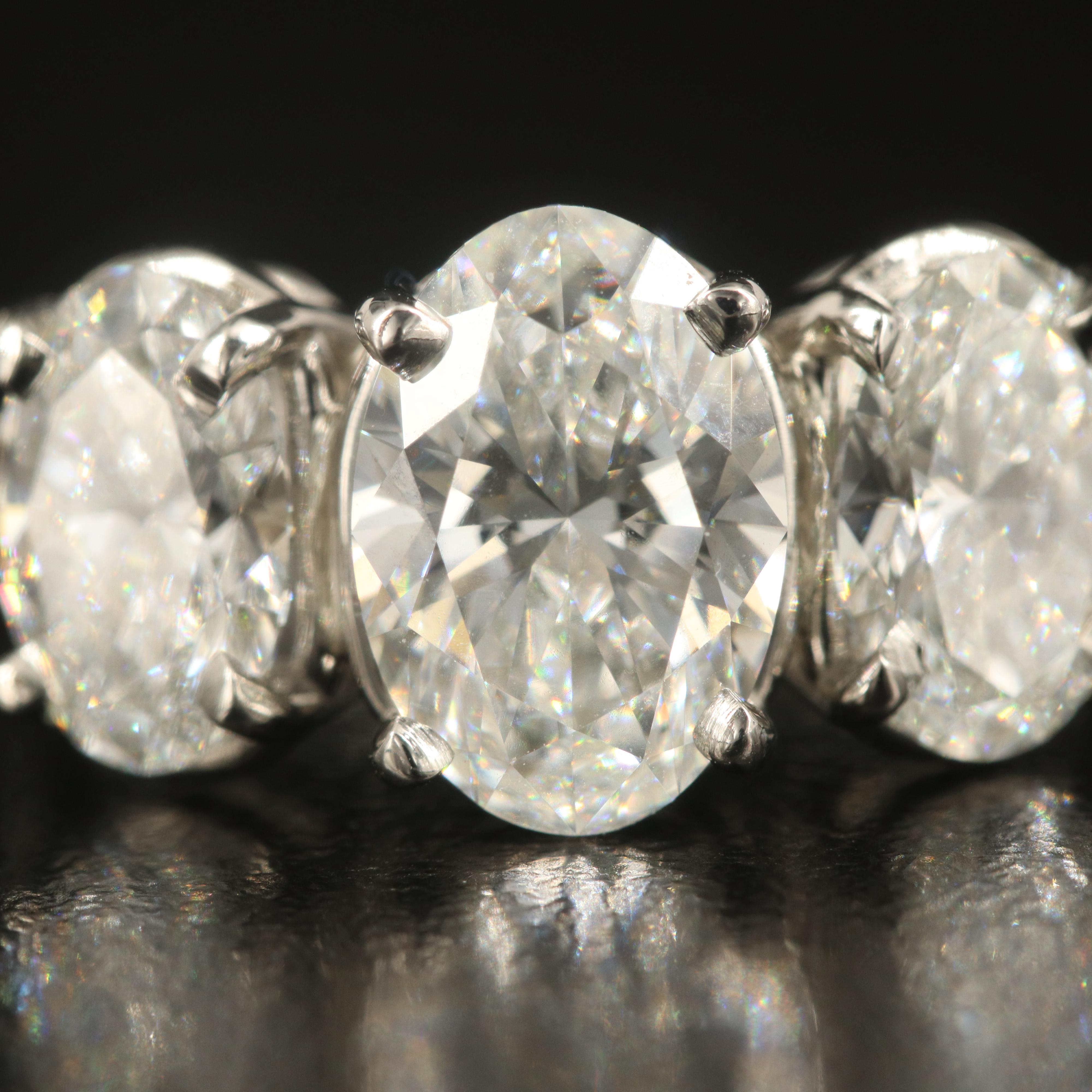 Platinum 4.28 CTW Diamond Three Stone Ring with IGI Reports