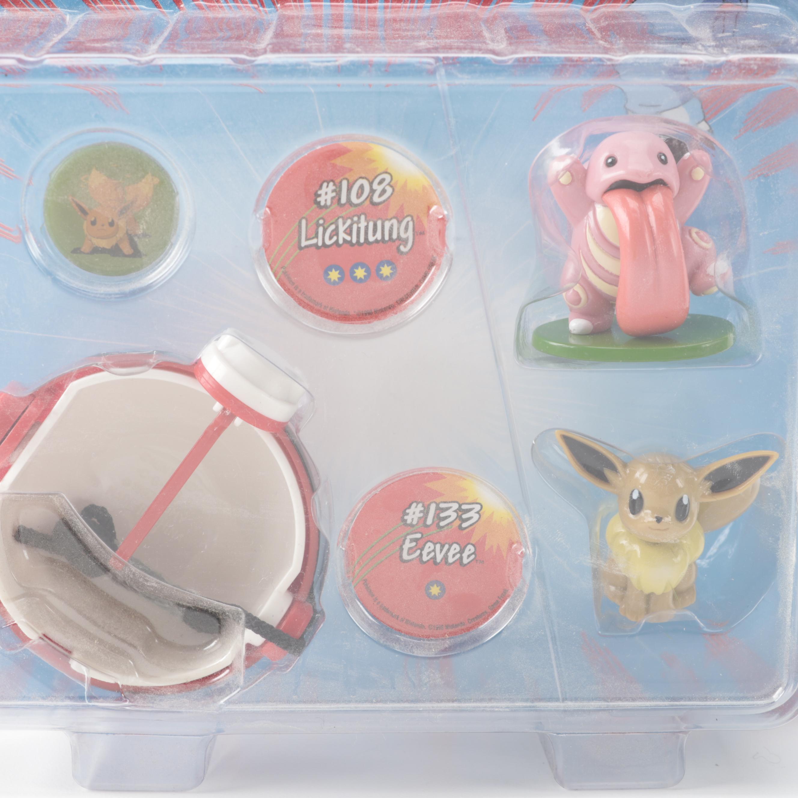 Poké Ball Blaster, Grabber Ball and Other Unopened Pokémon Figures and Toys