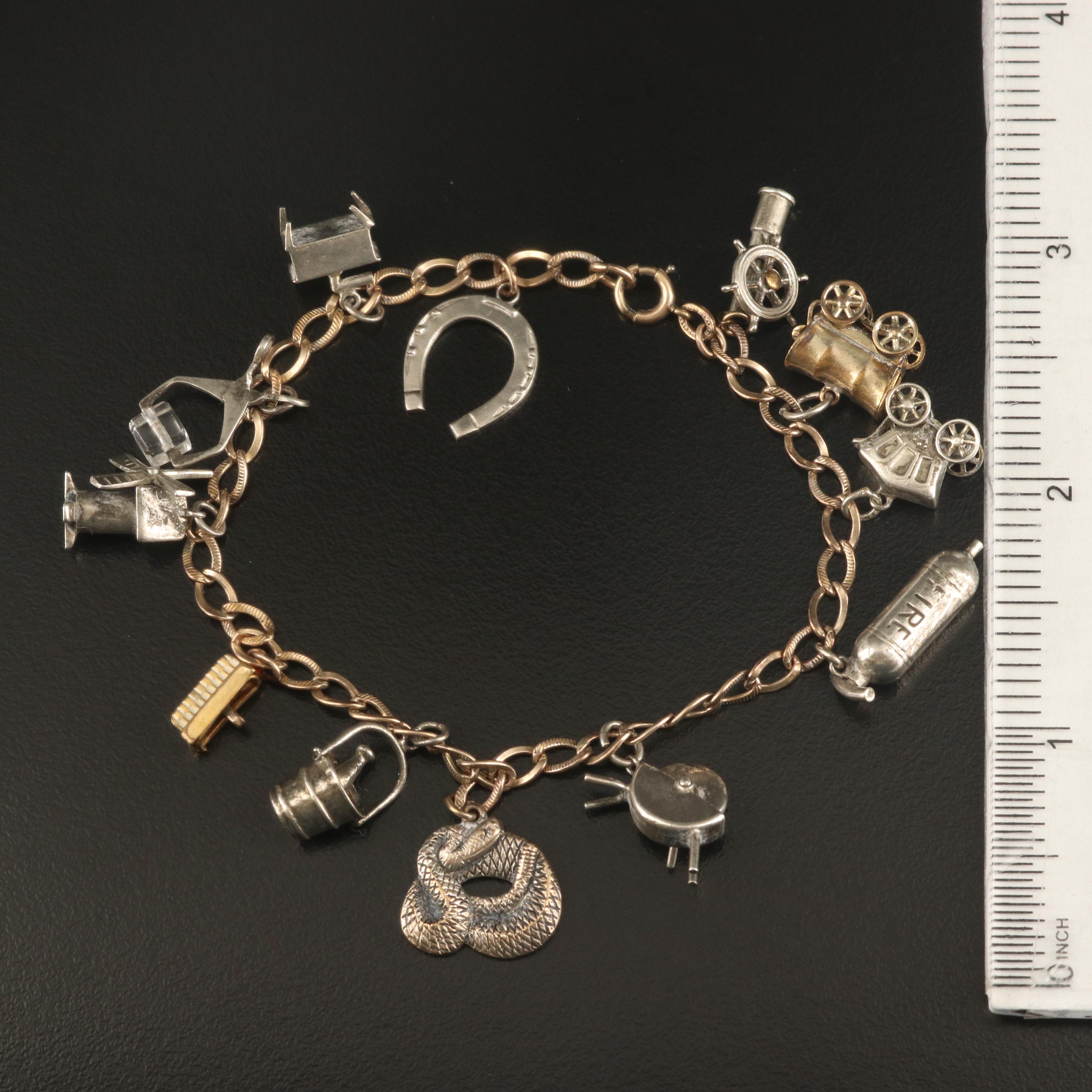 Charm Bracelet with Serpent and Windmill Charms