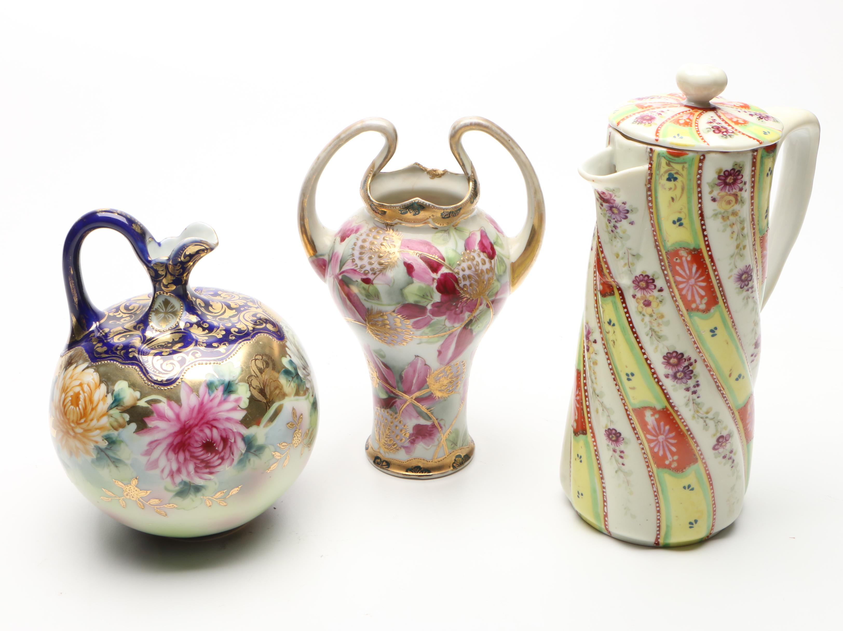 Japanese Porcelain Moriage Accented Vases and Chocolate Pot with Other Shakers