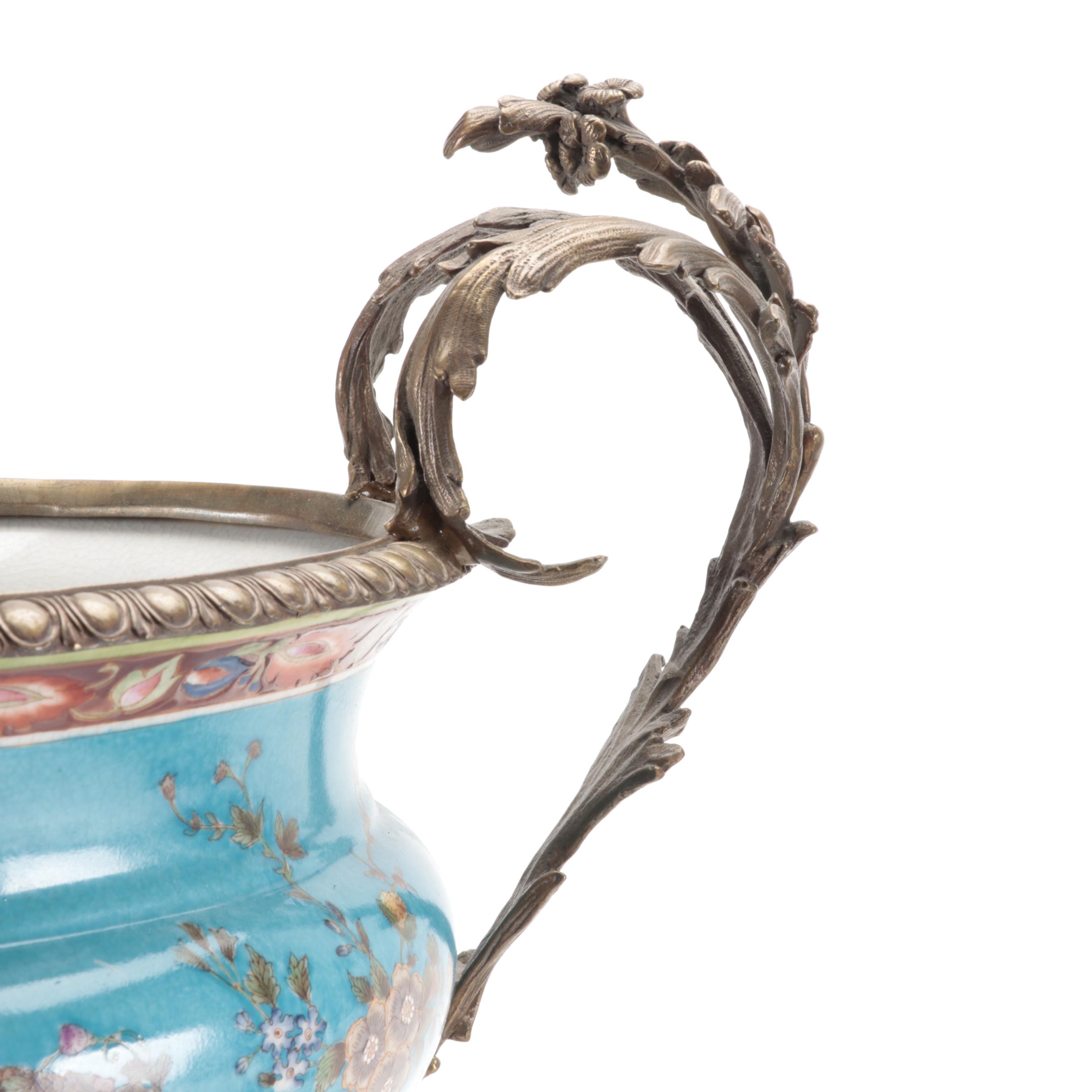 Pair of Wong Lee Sèvres Style Bleu Céleste Ormolu Mounted Porcelain Urns