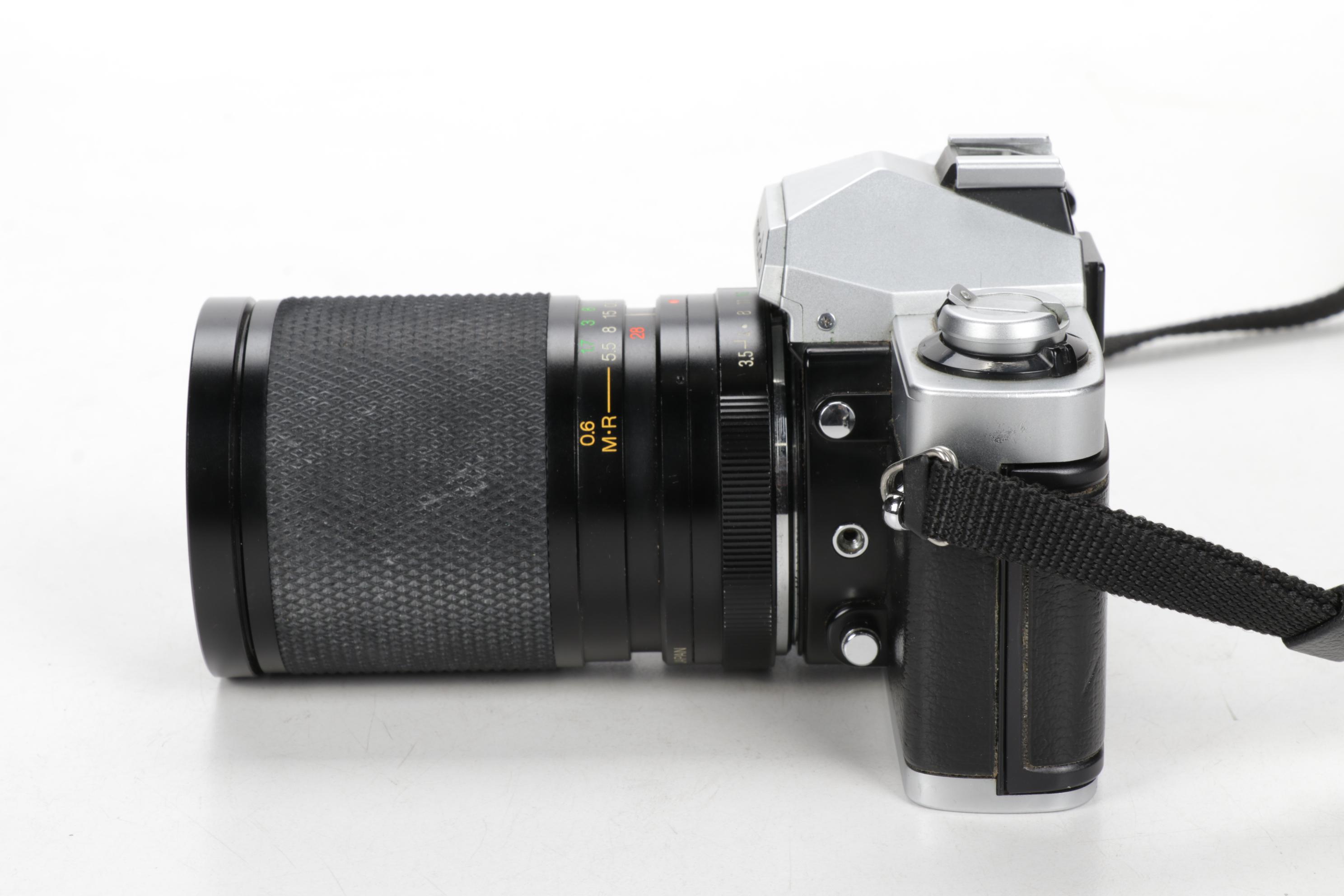 Minolta Maxxum 400si, XG9 and Nikon Point-and-Shoot Cameras with Accessories