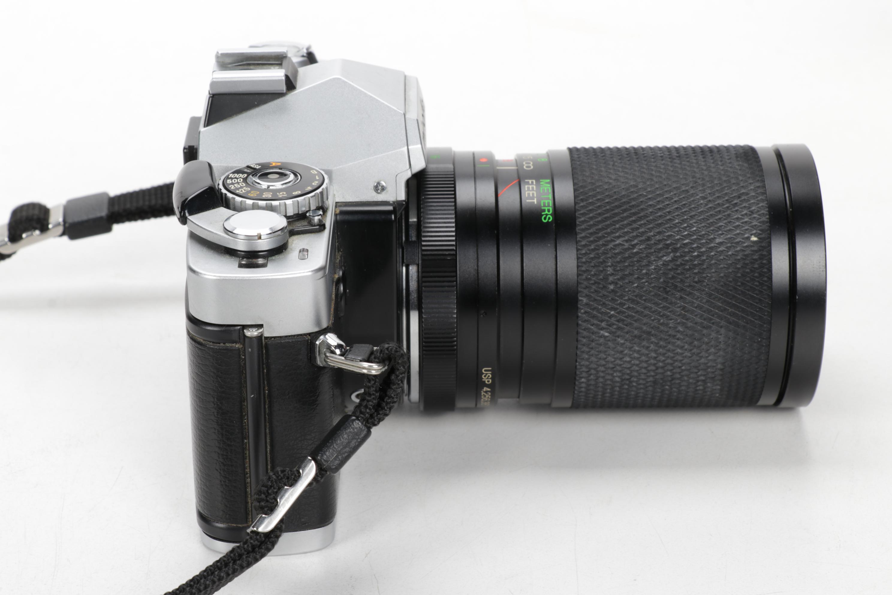 Minolta Maxxum 400si, XG9 and Nikon Point-and-Shoot Cameras with Accessories