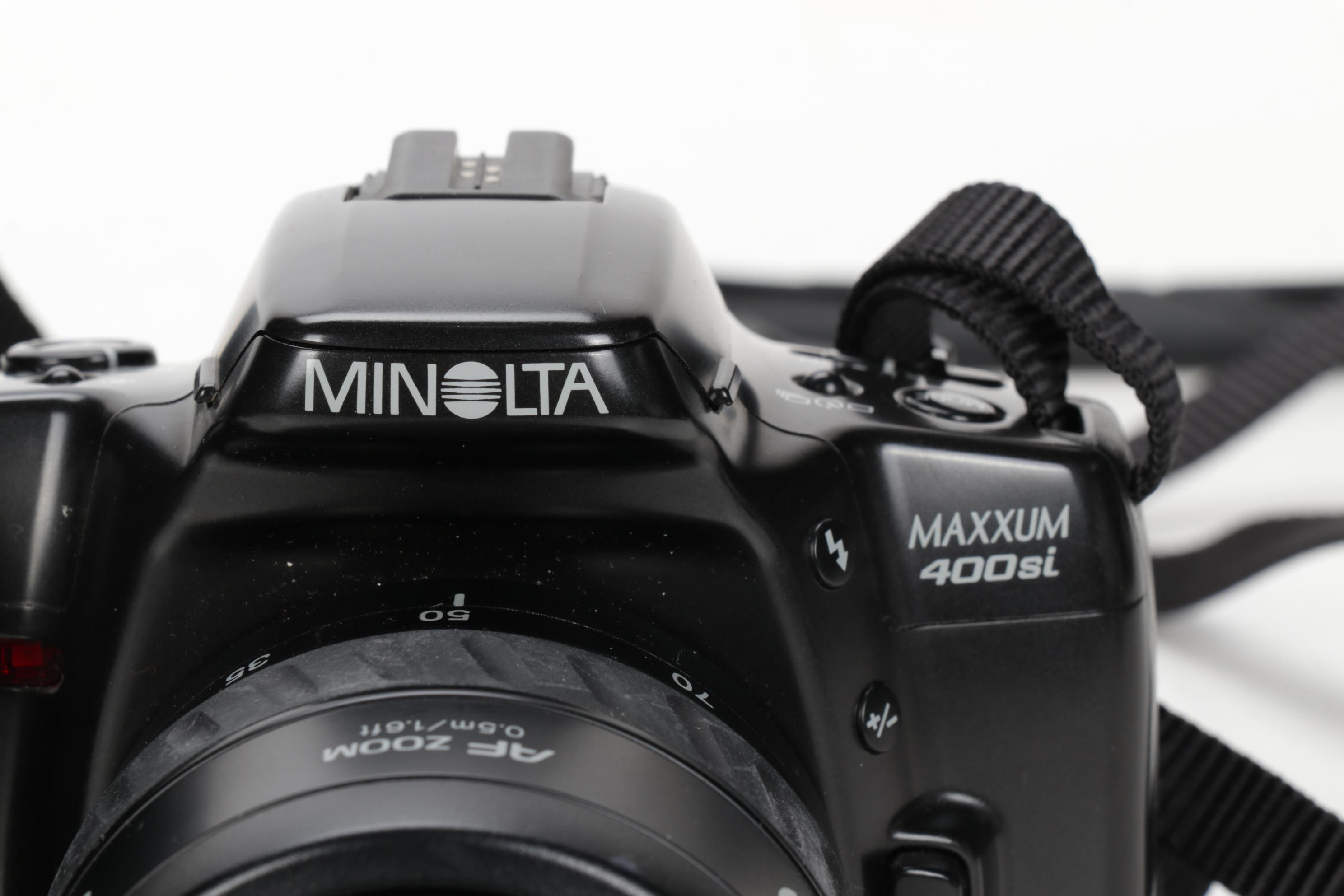 Minolta Maxxum 400si, XG9 and Nikon Point-and-Shoot Cameras with Accessories