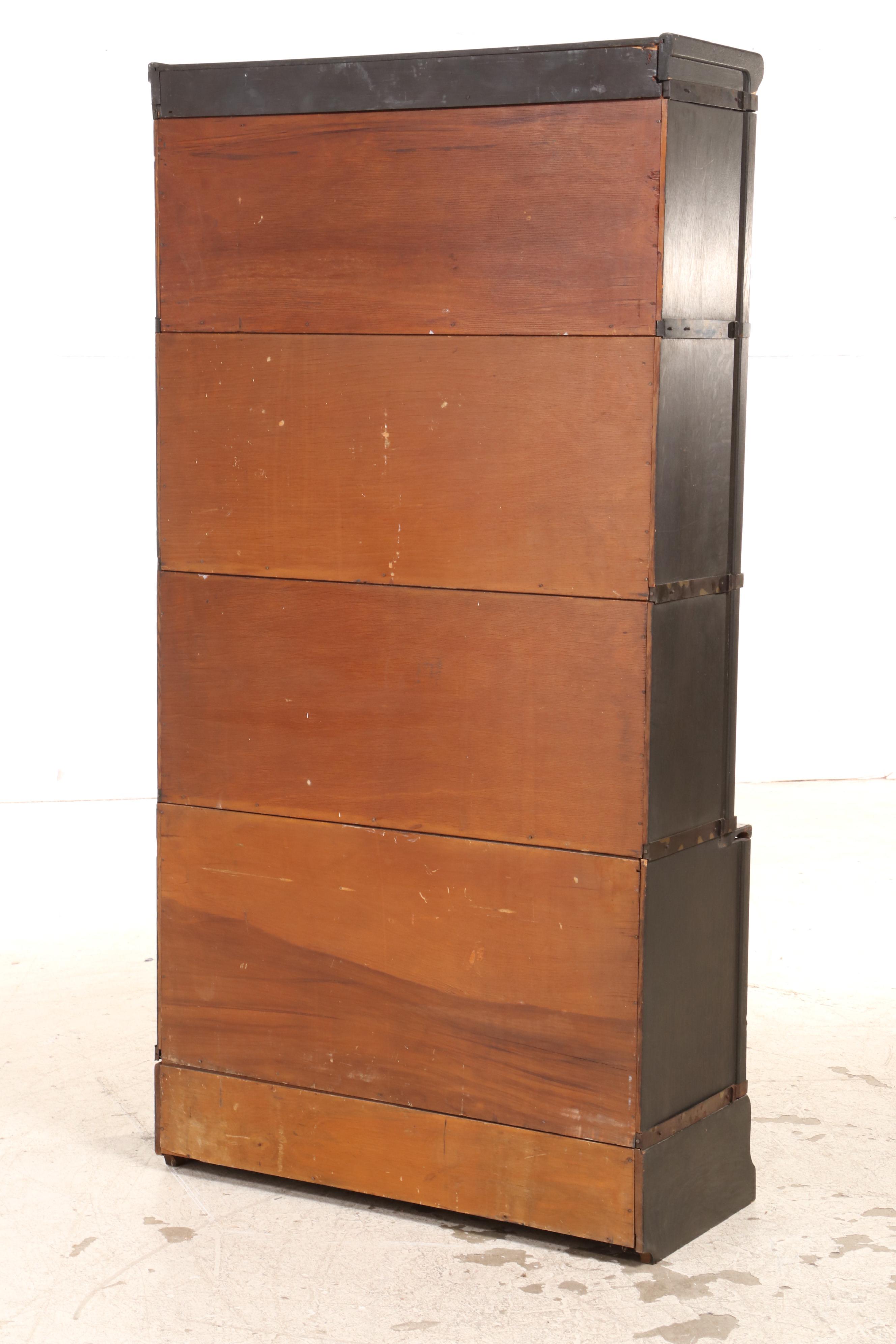The Globe-Wernicke Co. Ebonized Oak Four-Stack Barrister's Bookcase with Drawer