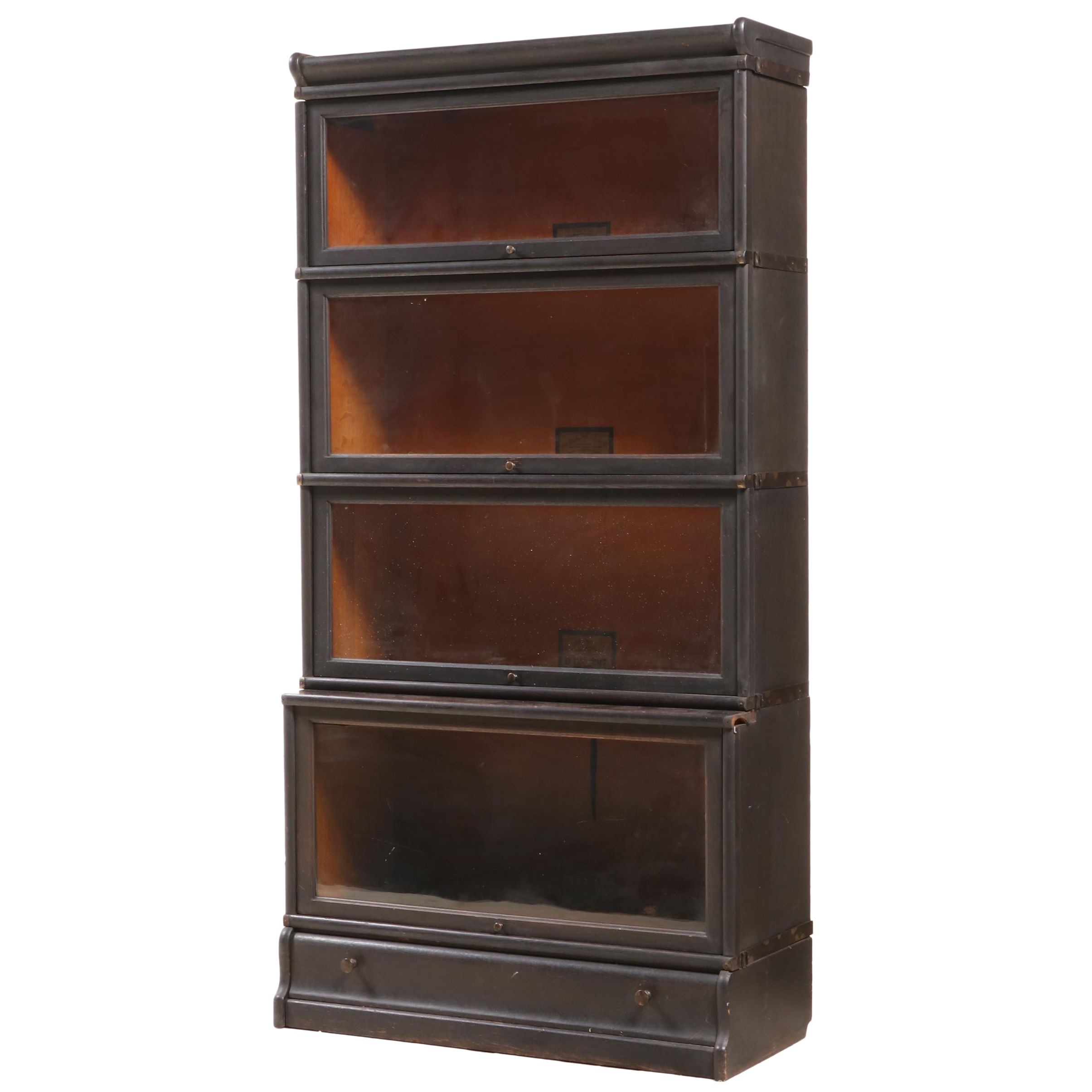 The Globe-Wernicke Co. Ebonized Oak Four-Stack Barrister's Bookcase with Drawer