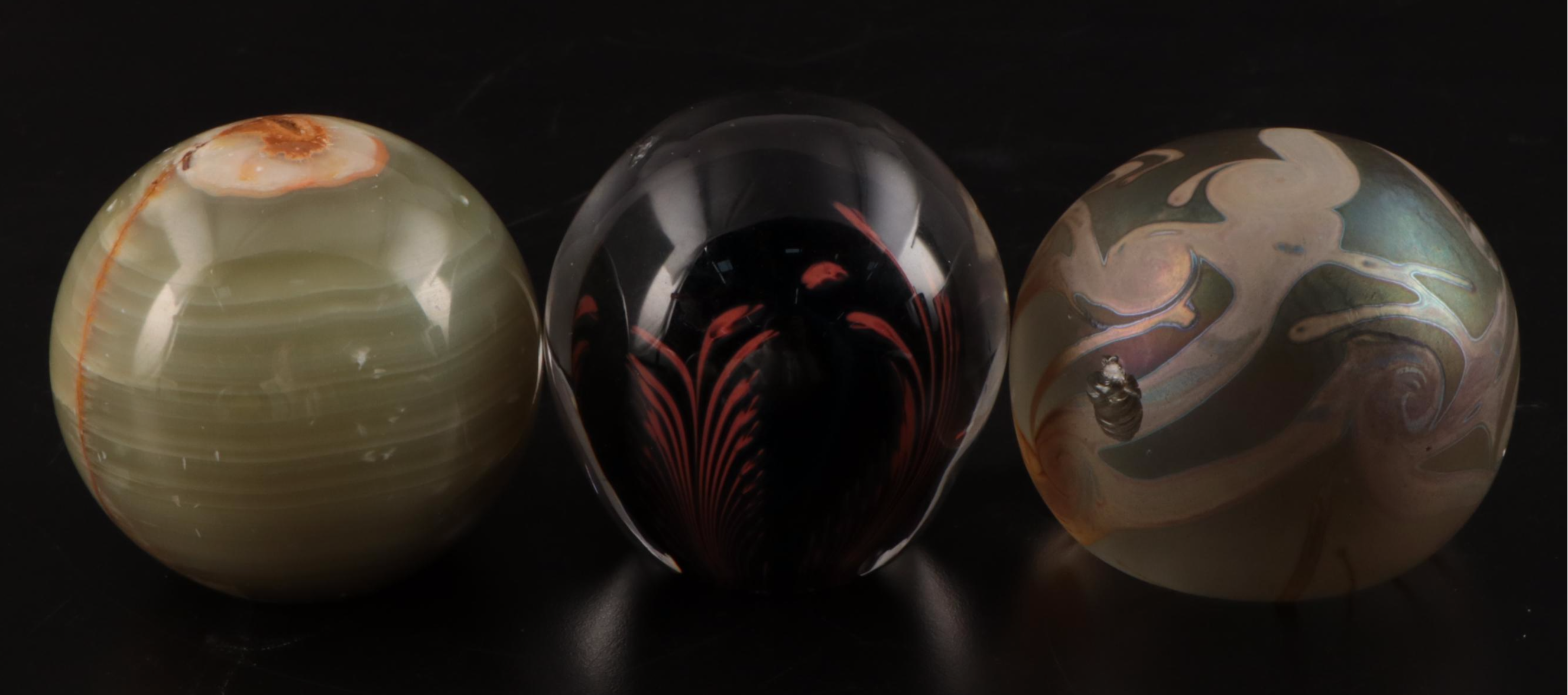 Jim McClure Iridescent Glass Paperweight with Other Glass and Stone Paperweights