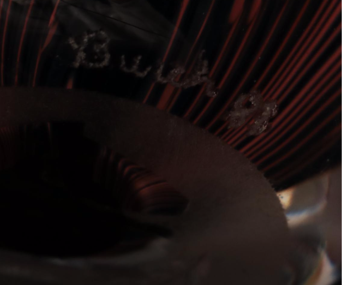 Jim McClure Iridescent Glass Paperweight with Other Glass and Stone Paperweights