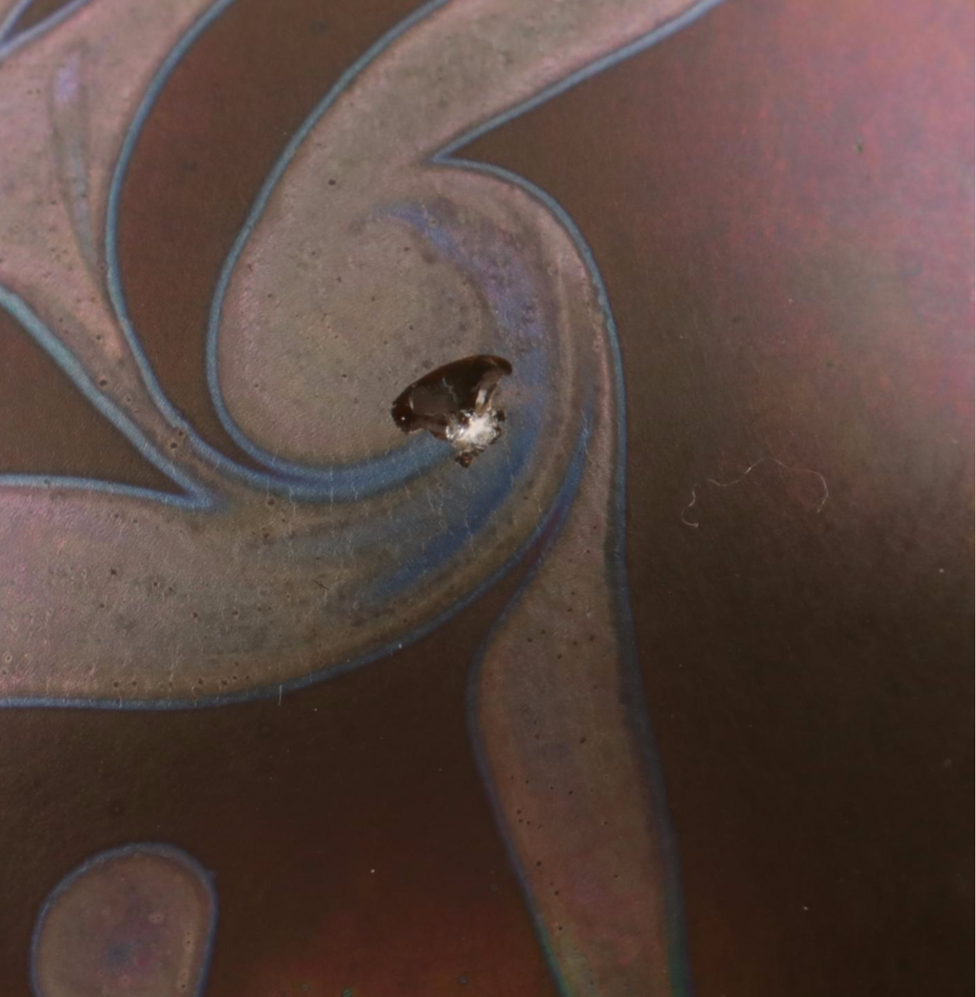 Jim McClure Iridescent Glass Paperweight with Other Glass and Stone Paperweights