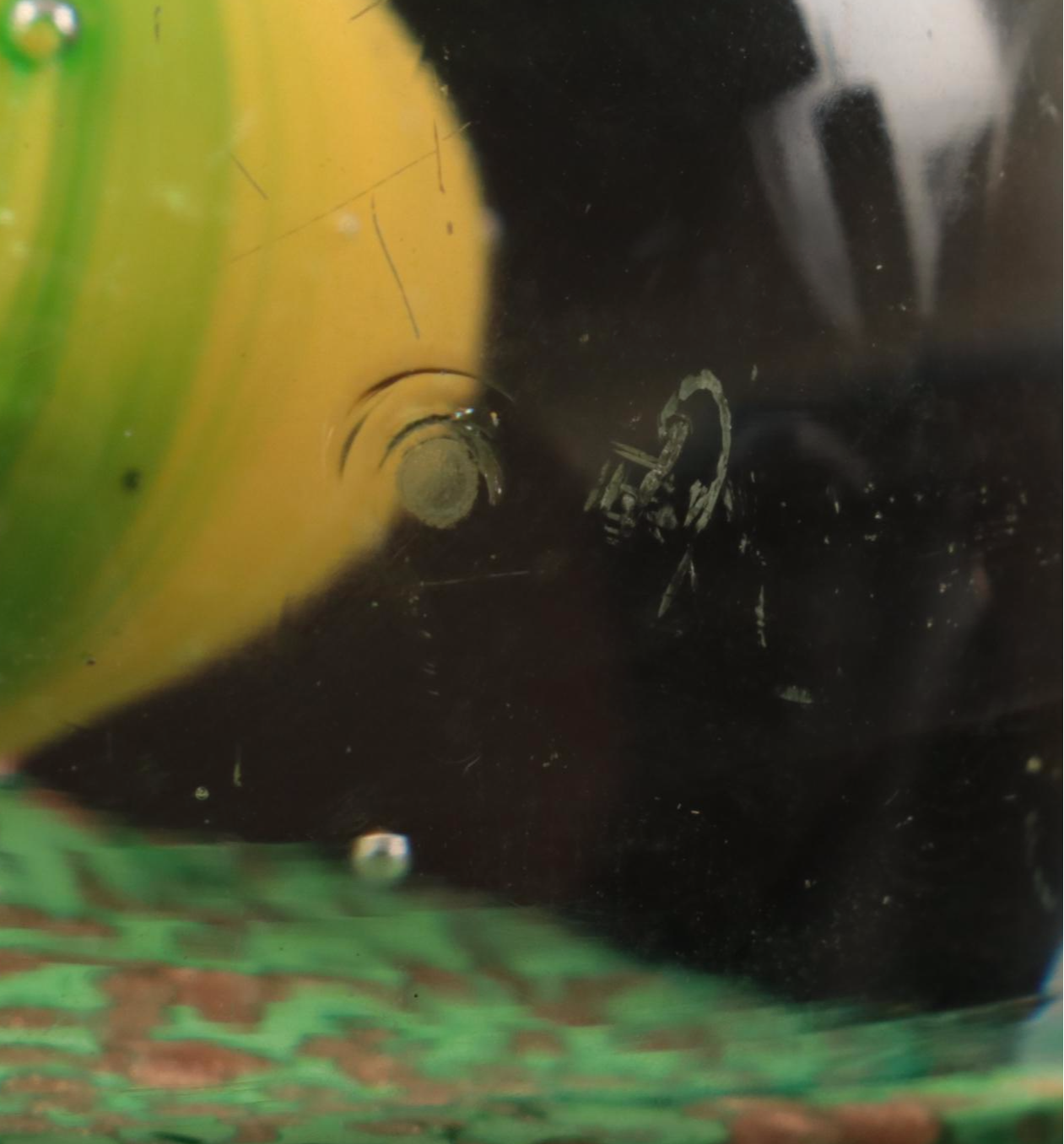 Jim McClure Iridescent Glass Paperweight with Other Glass and Stone Paperweights