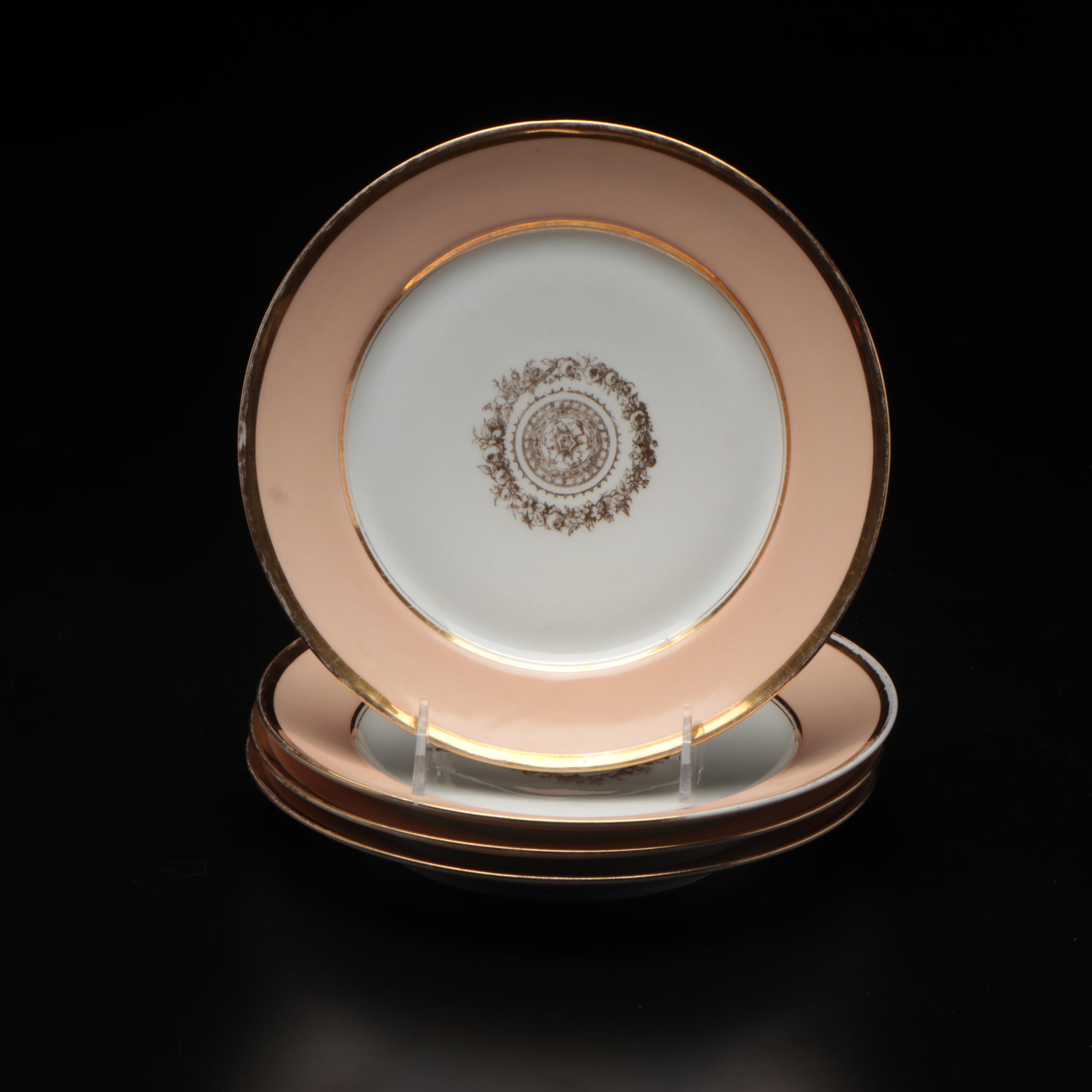 European Peach and Gilt Rimmed Porcelain Dinner Plates with Floral Medallion