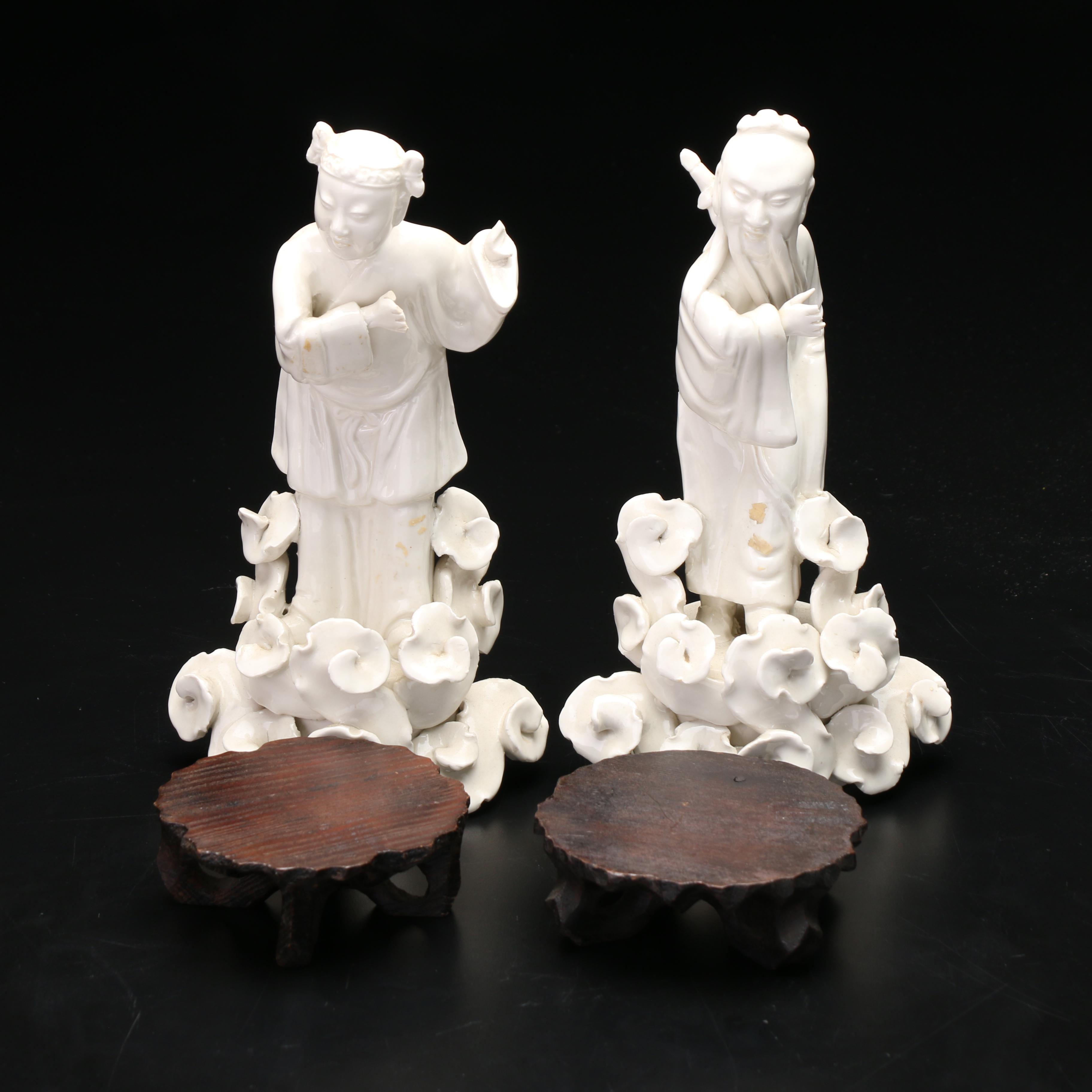 Chinese Blanc de Chine Figurines with Carved Wooden Stands