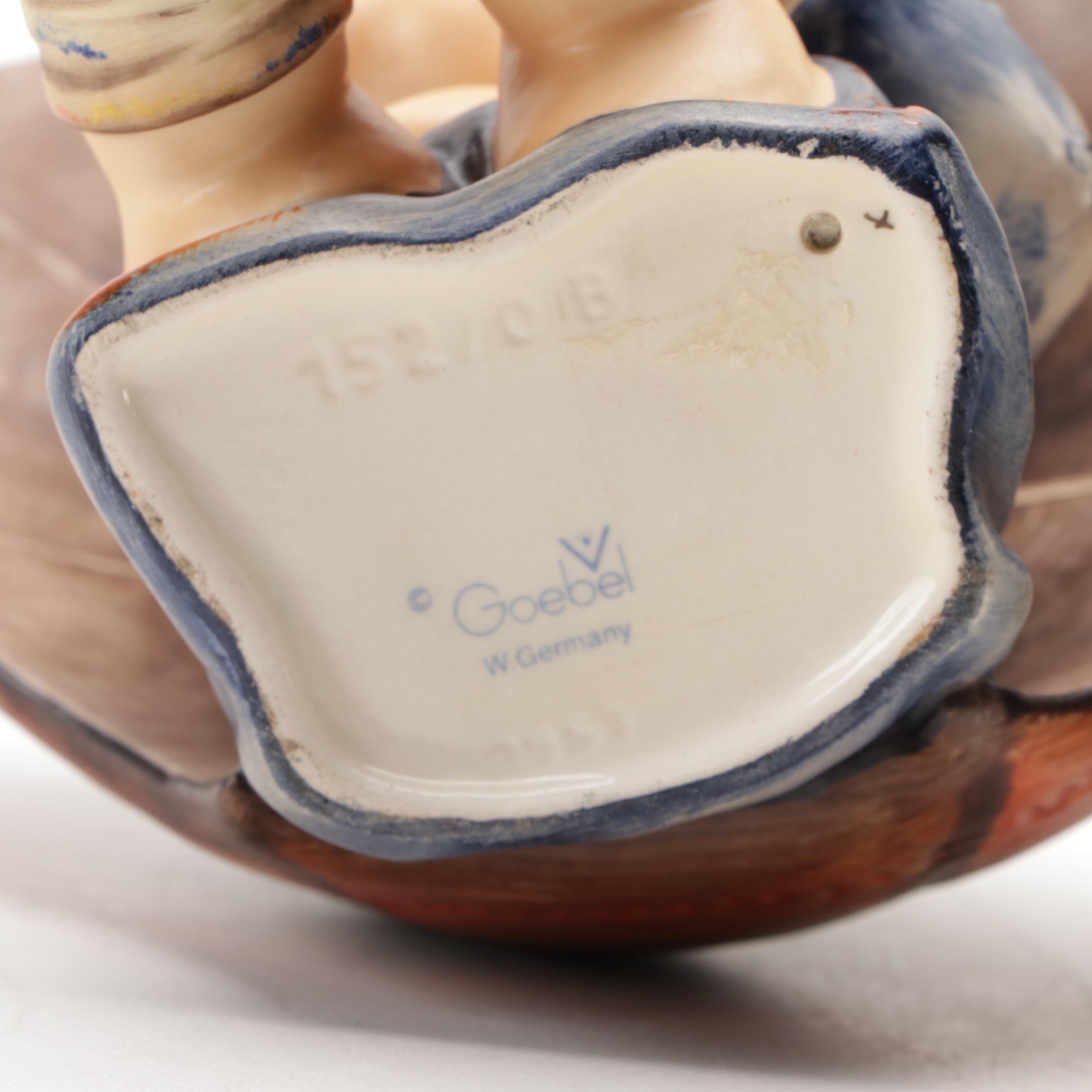 Goebel "Umbrella Boy" and "Umbrella Girl" Porcelain Hummel Figurines