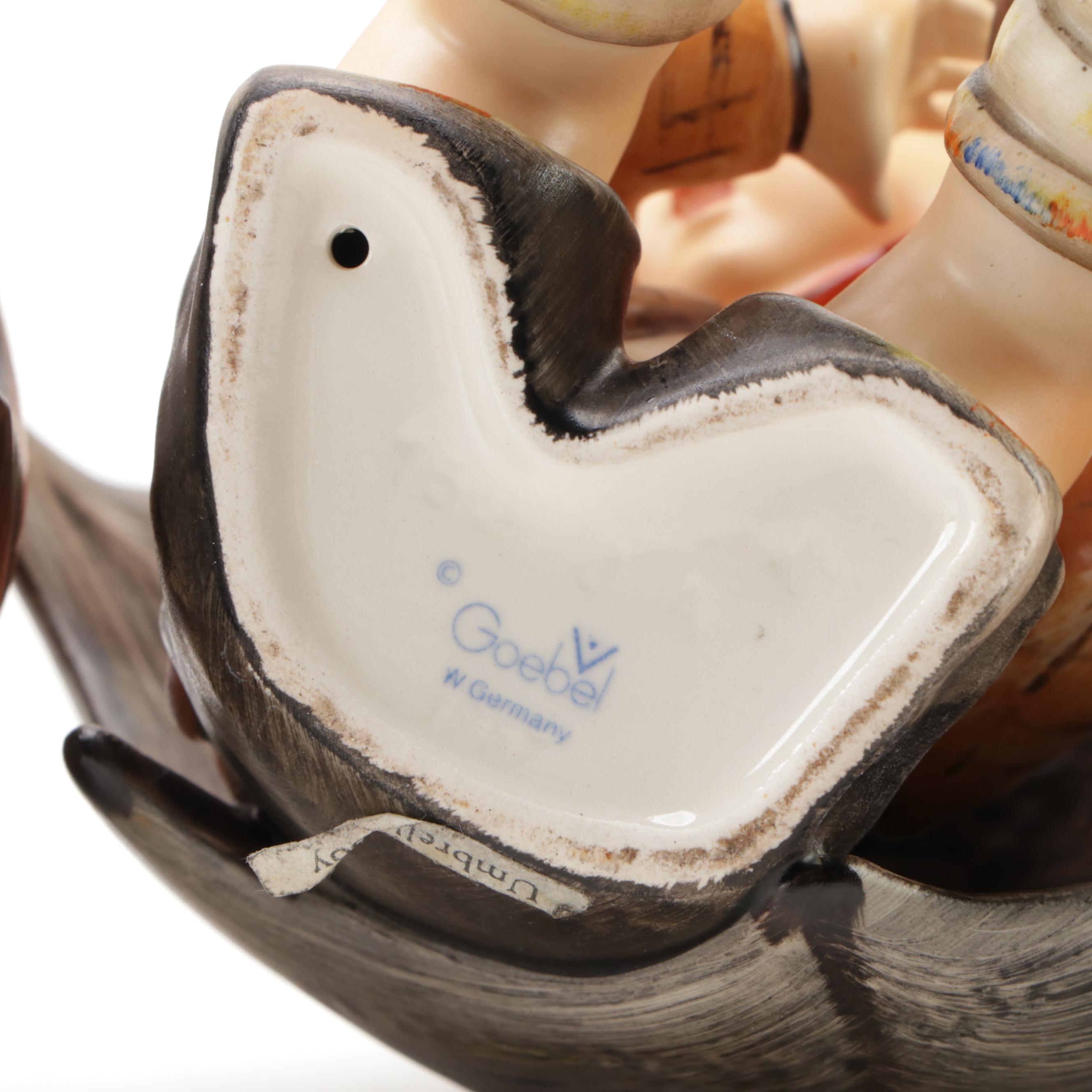 Goebel "Umbrella Boy" and "Umbrella Girl" Porcelain Hummel Figurines