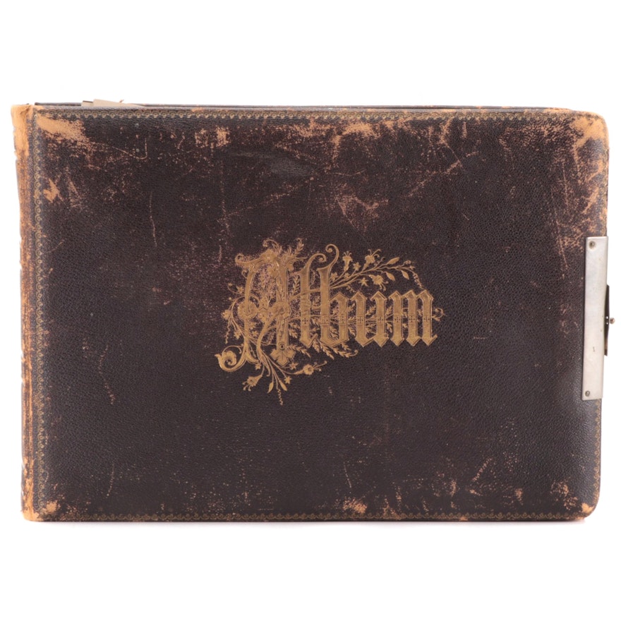 Embossed Leather Album with Portraits of Men, Women and Children